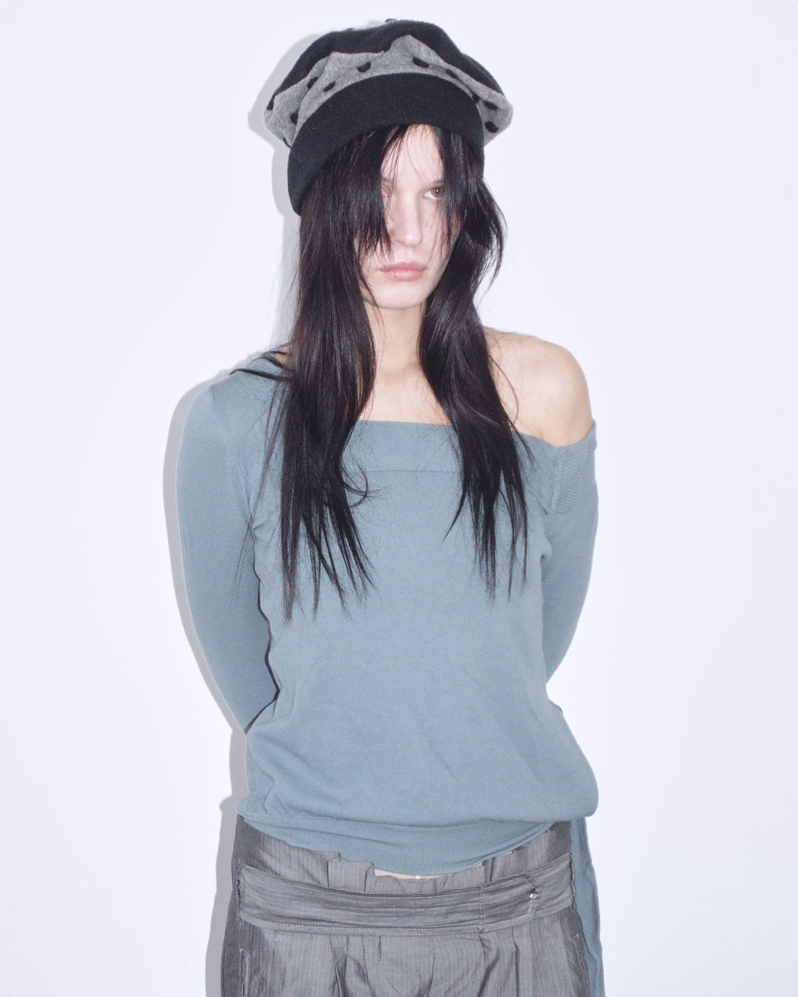 black and gray wool felt cloche hat with pom-pom details