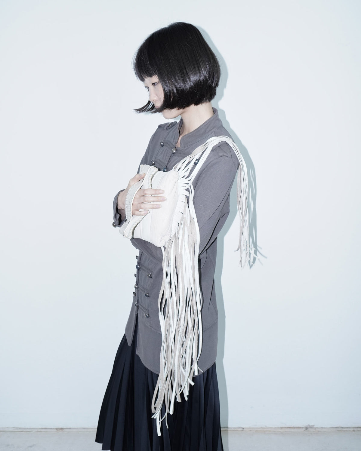 white leather fringed mini bag
