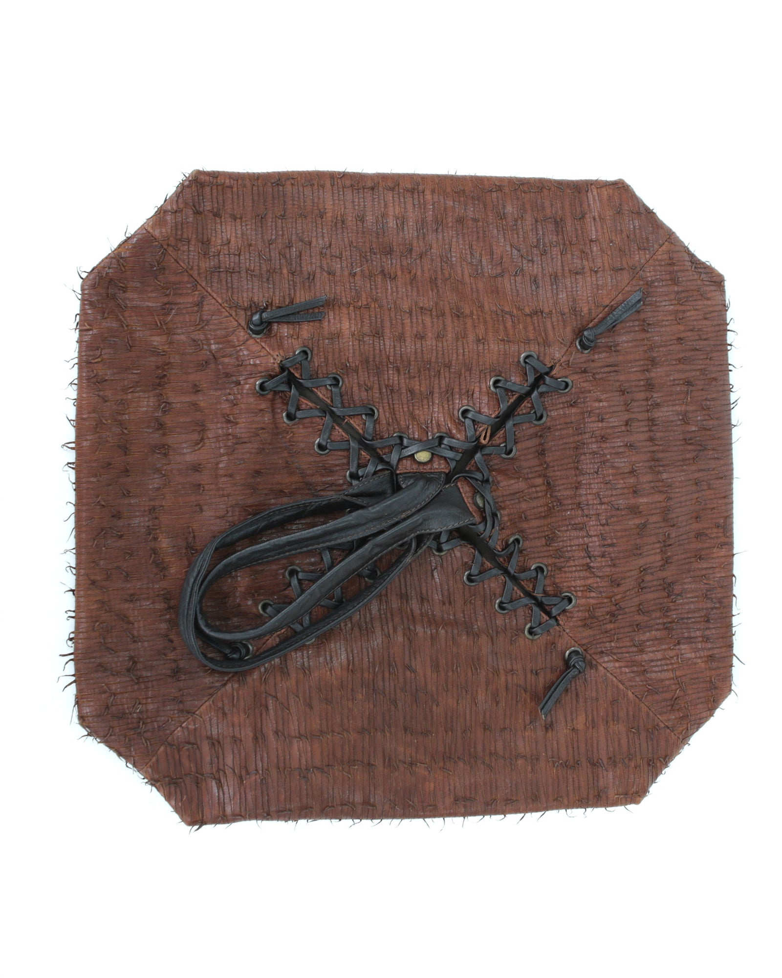 brown and black geometric textured leather bag