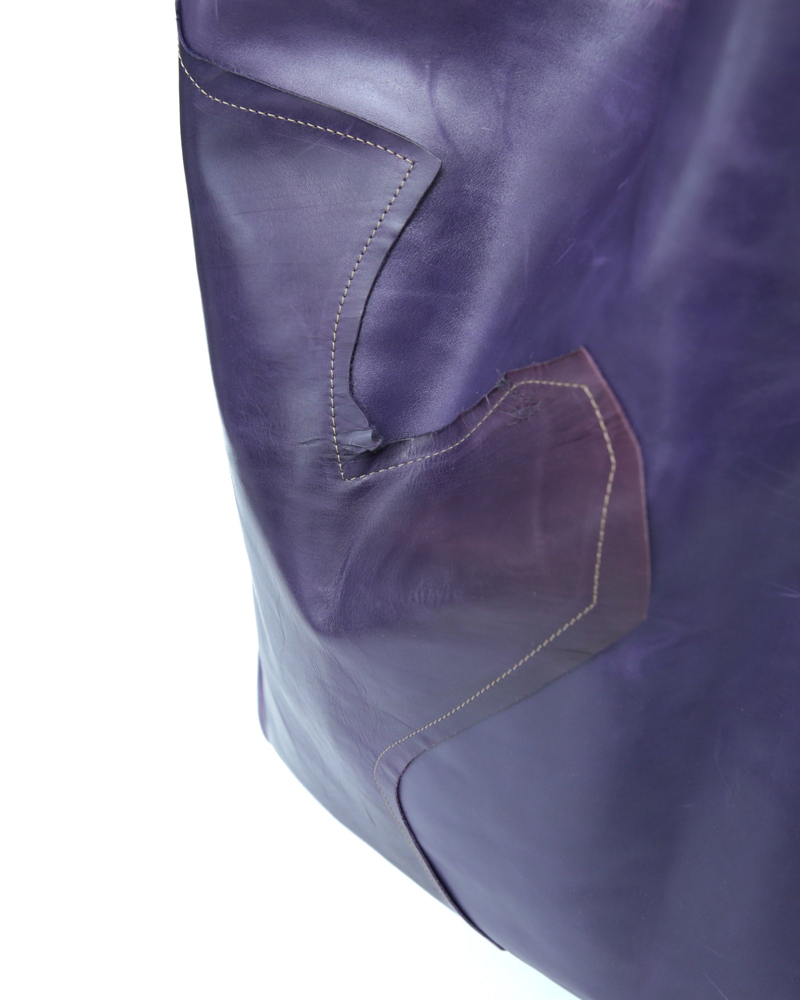 large violet leather tote bag with fringe detail