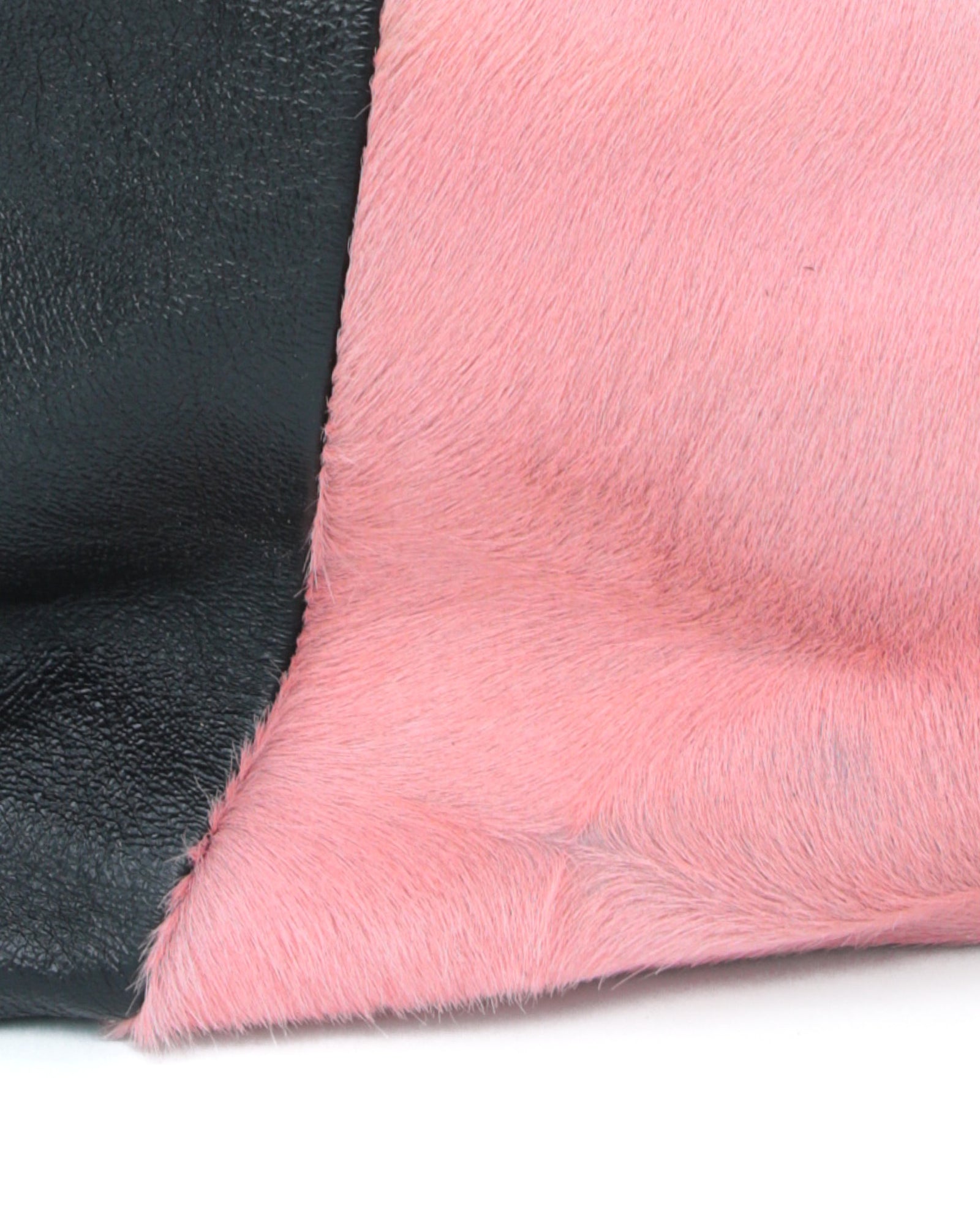 pink pony hair and black shiny leather bag