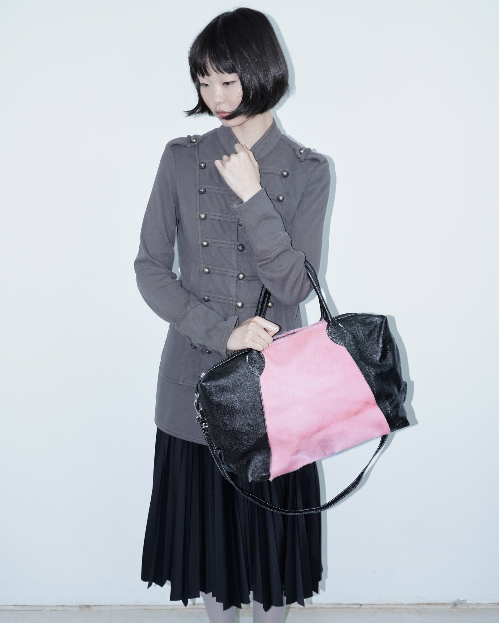 pink pony hair and black shiny leather bag