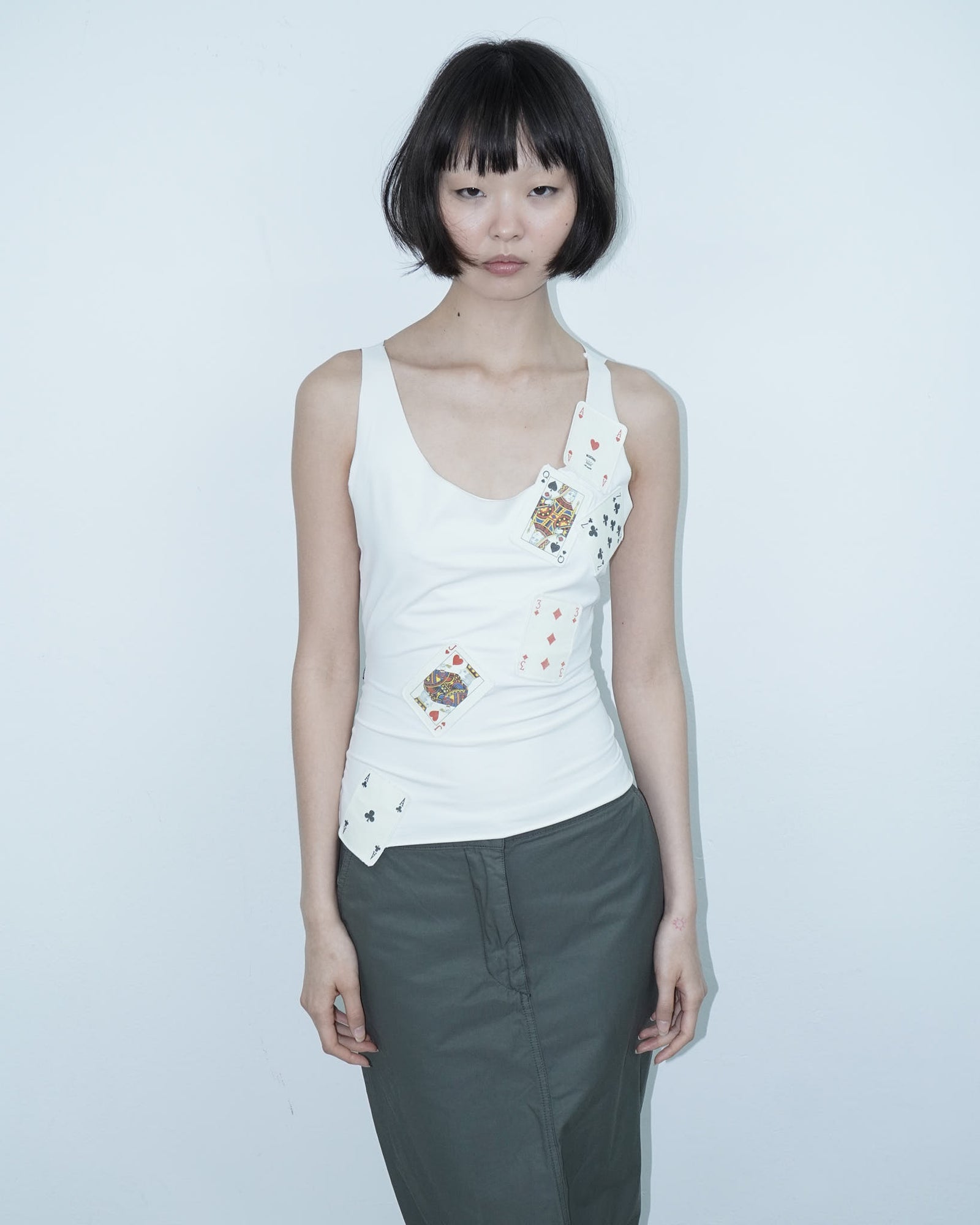 white top with poker cards