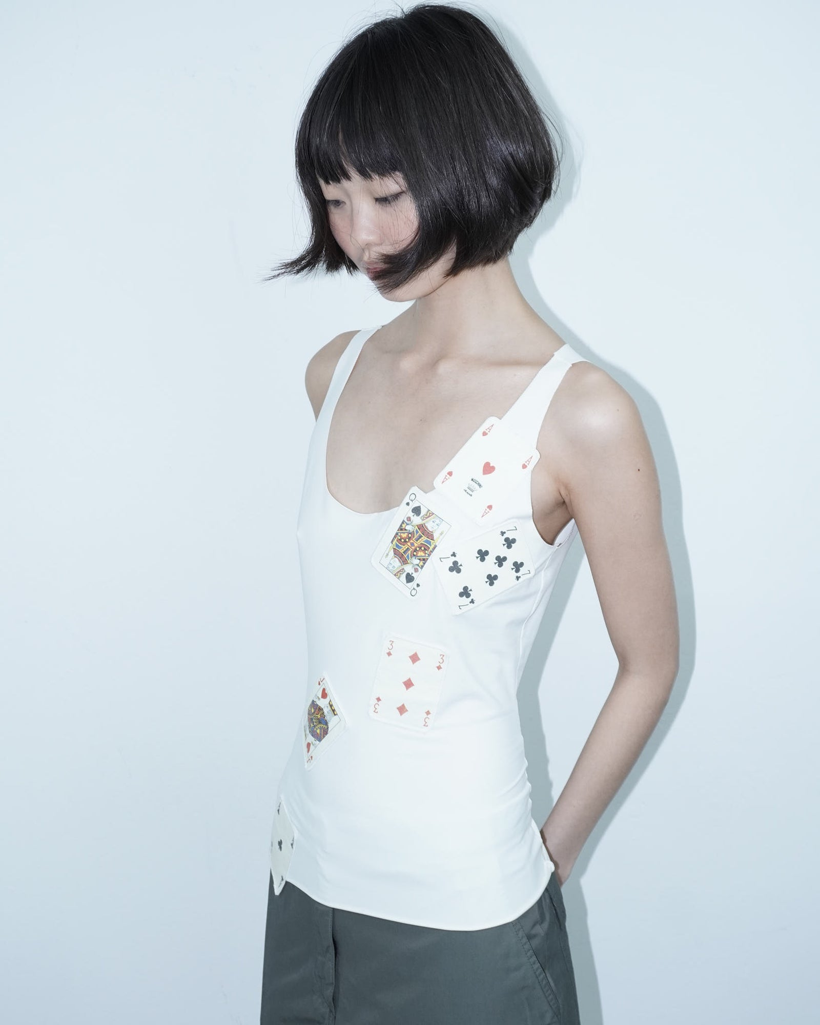 white top with poker cards