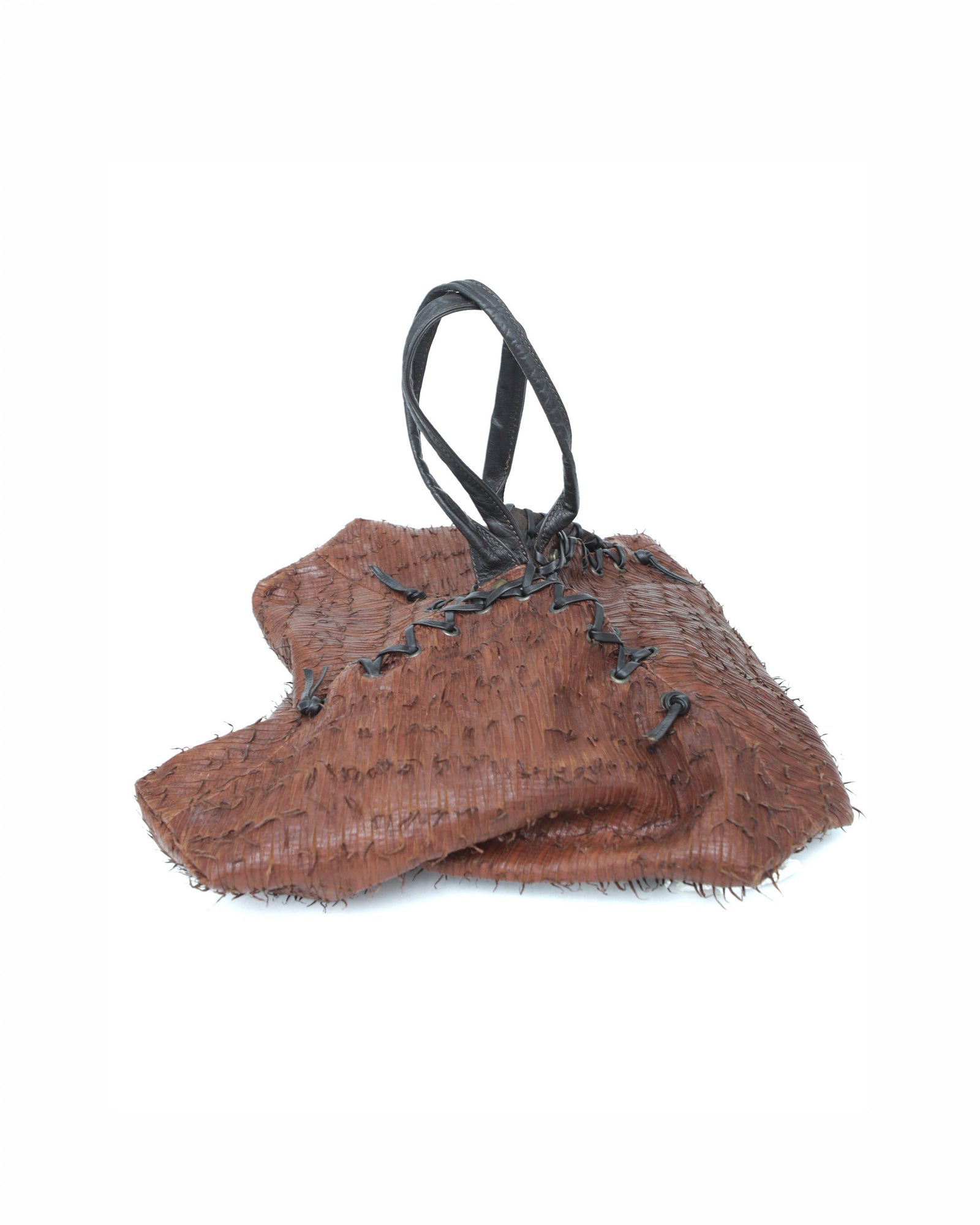 brown and black geometric textured leather bag