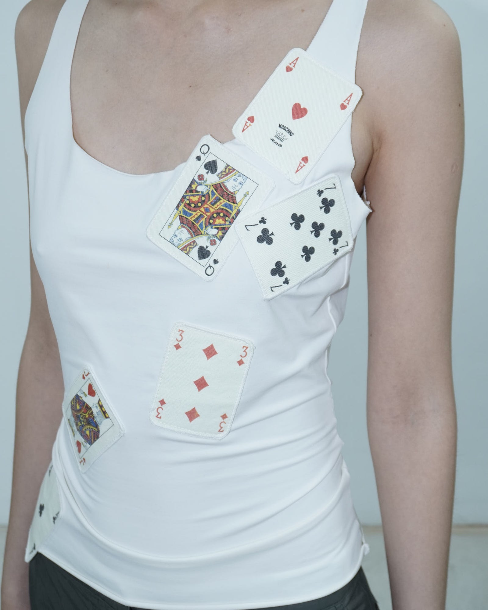 white top with poker cards