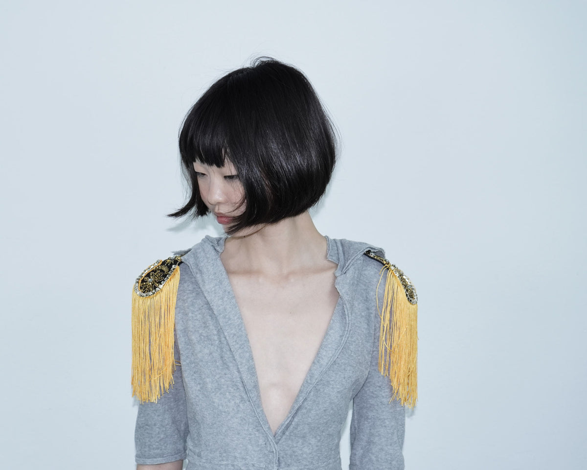 orange embellished fringed shoulder patches