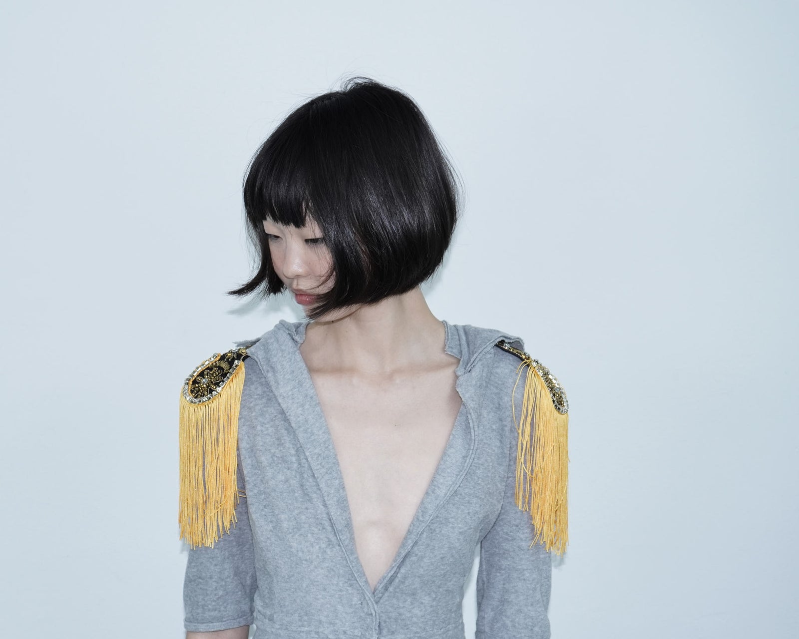 orange embellished fringed shoulder patches