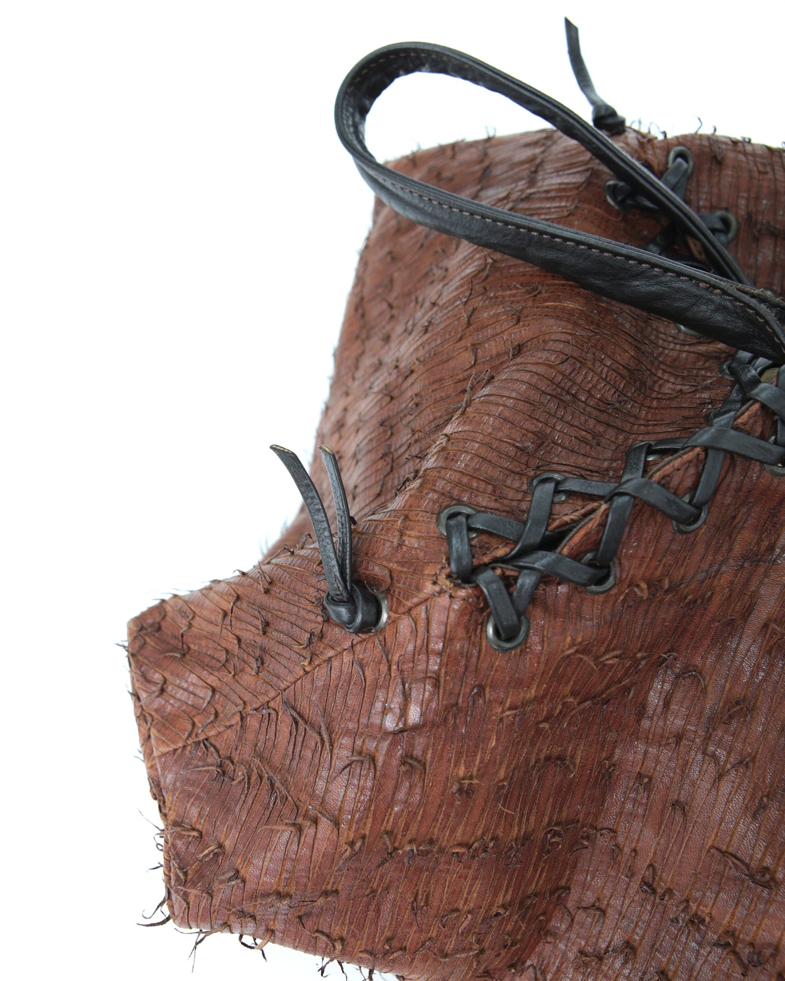 brown and black geometric textured leather bag