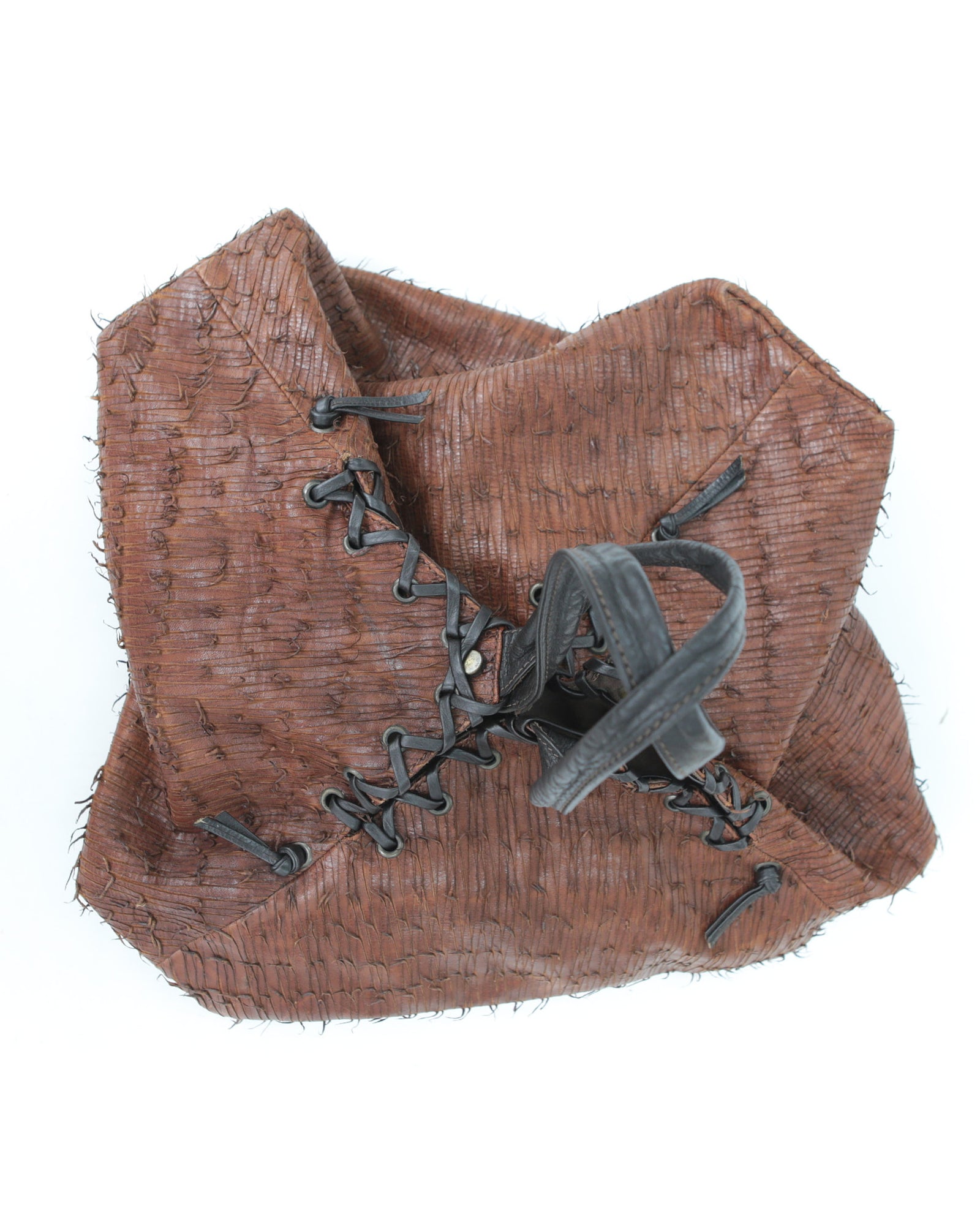 brown and black geometric textured leather bag