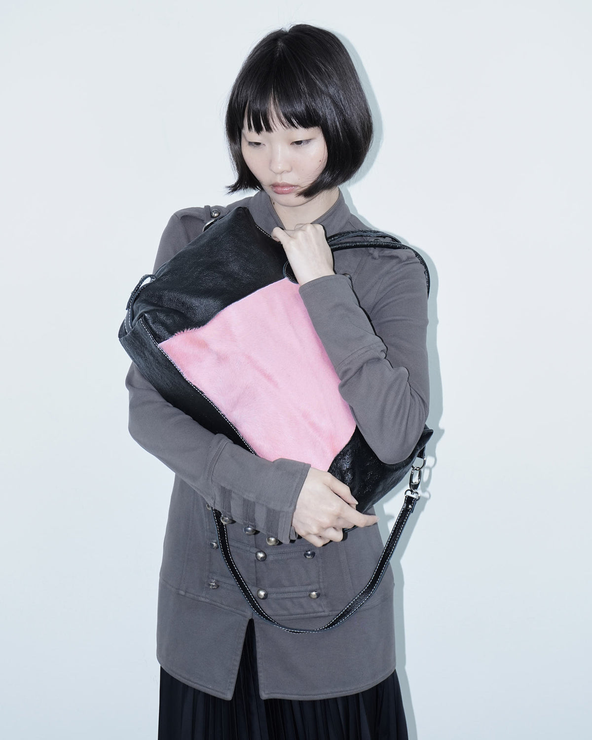 pink pony hair and black shiny leather bag