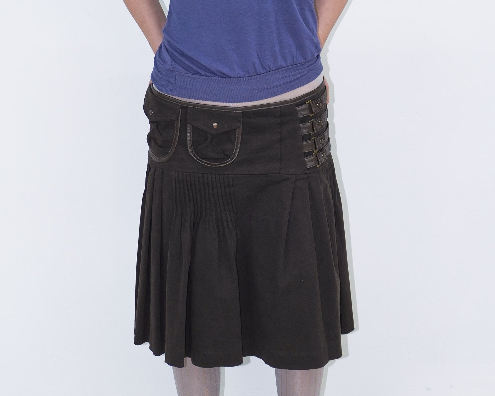 asymmetrical brown pleated midi skirt