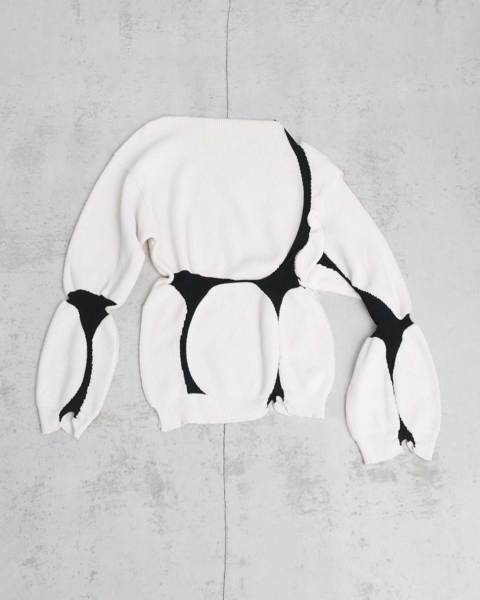 asymmetrical virgin wool sweater with puffed cuffs