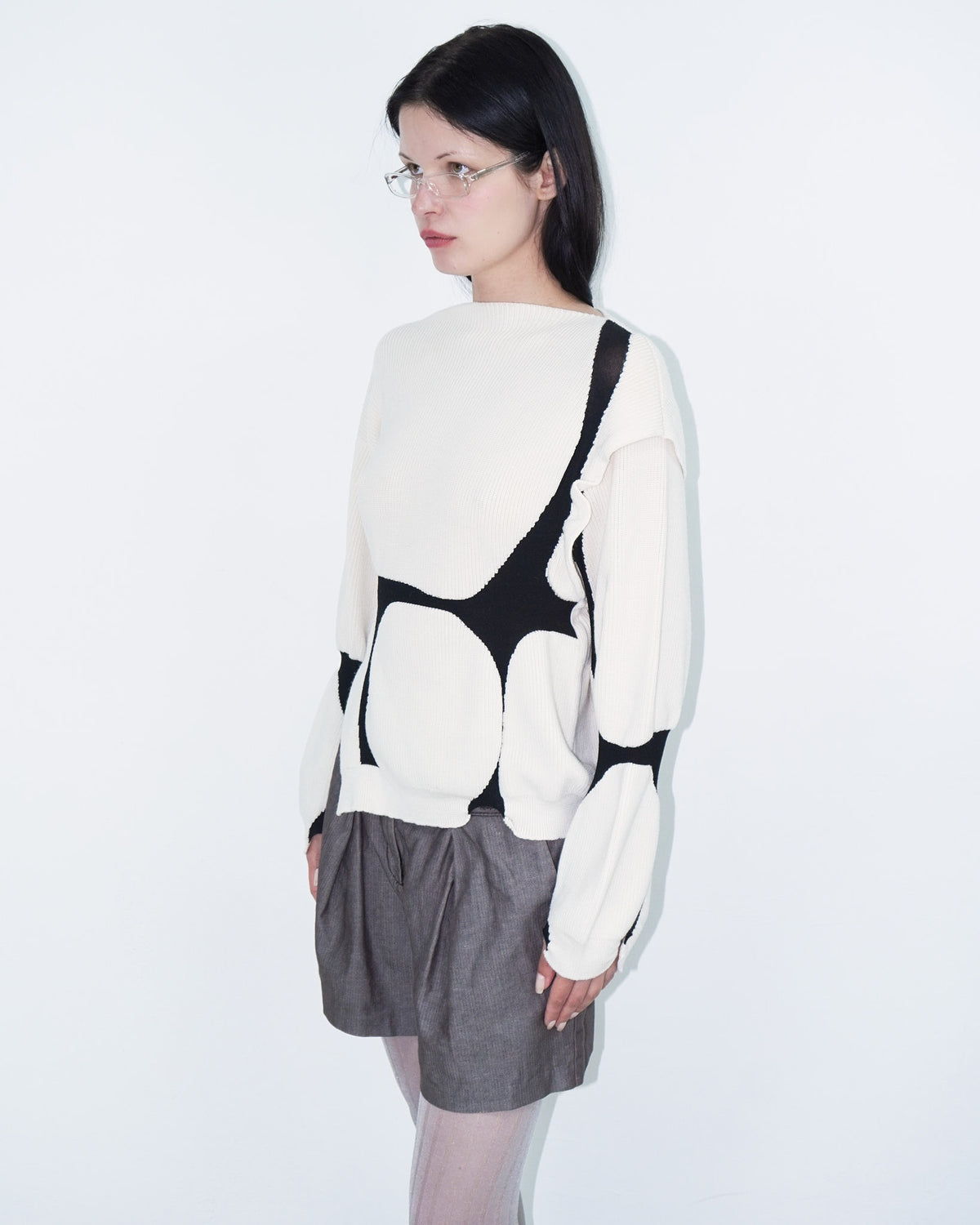 asymmetrical virgin wool sweater with puffed cuffs
