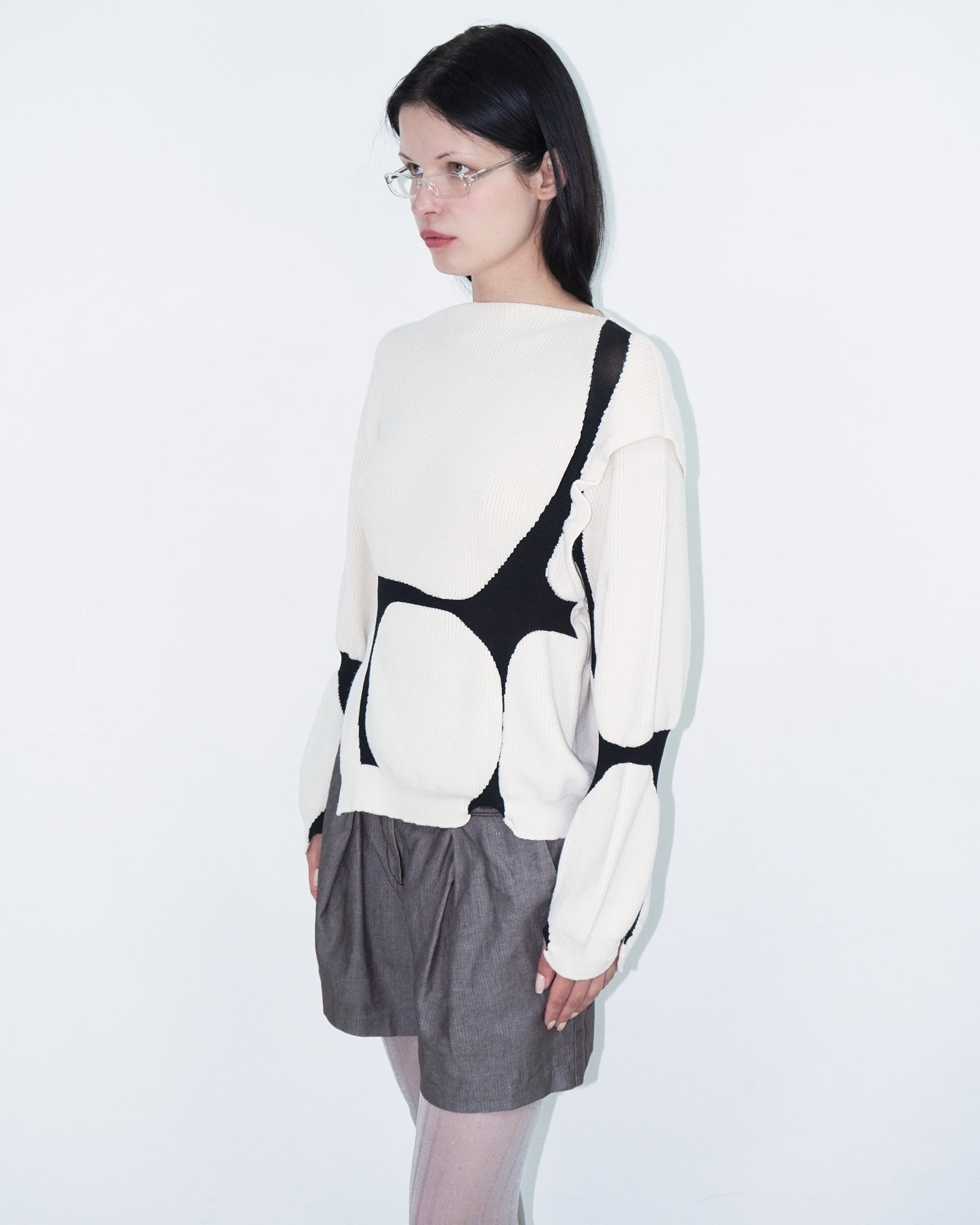 asymmetrical virgin wool sweater with puffed cuffs
