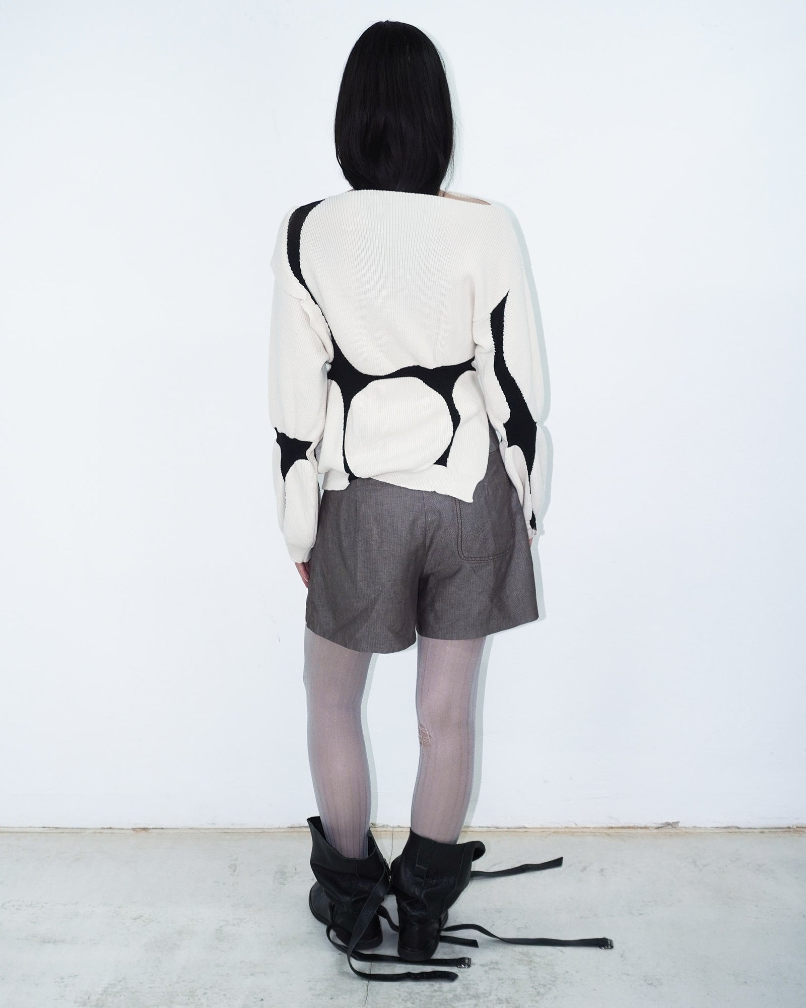 asymmetrical virgin wool sweater with puffed cuffs