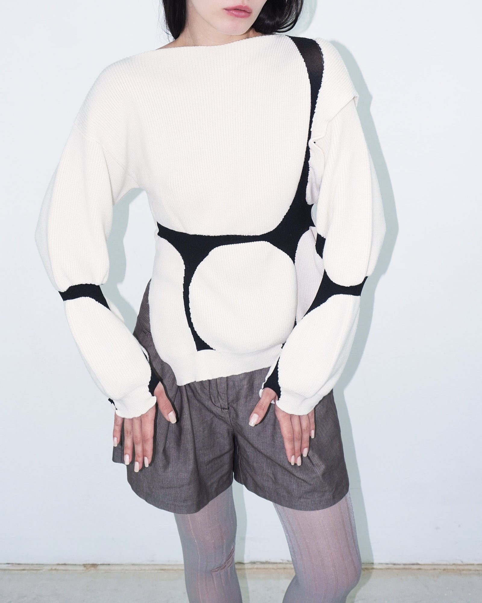 asymmetrical virgin wool sweater with puffed cuffs