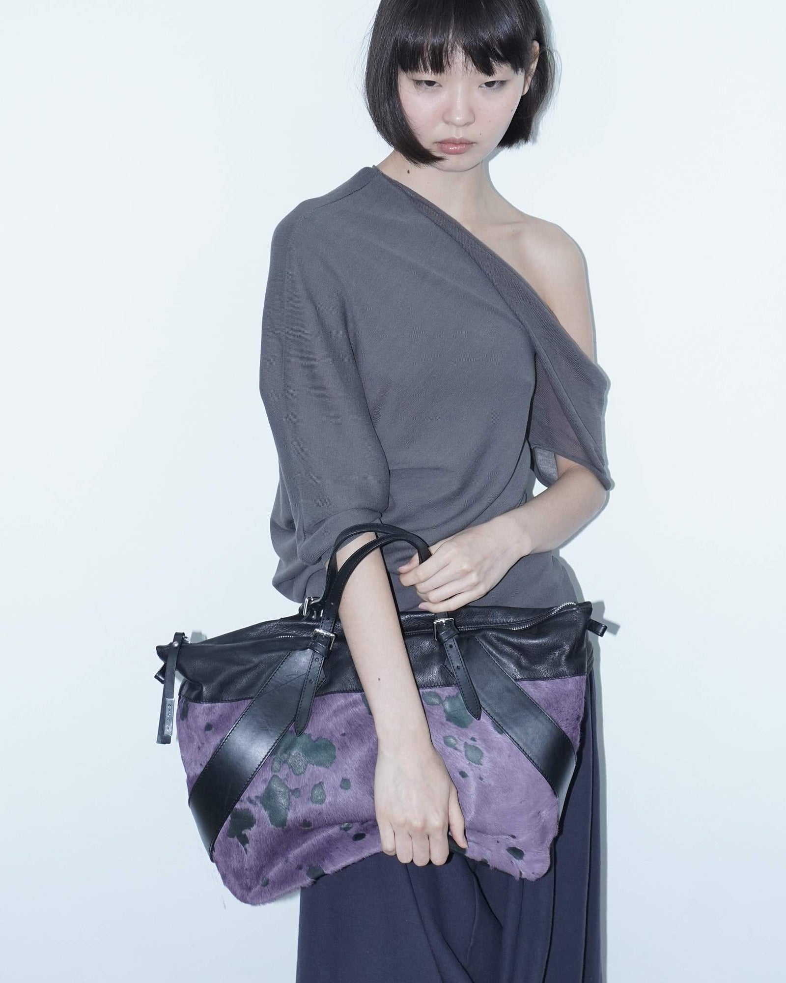 big purple and black pony hair bag