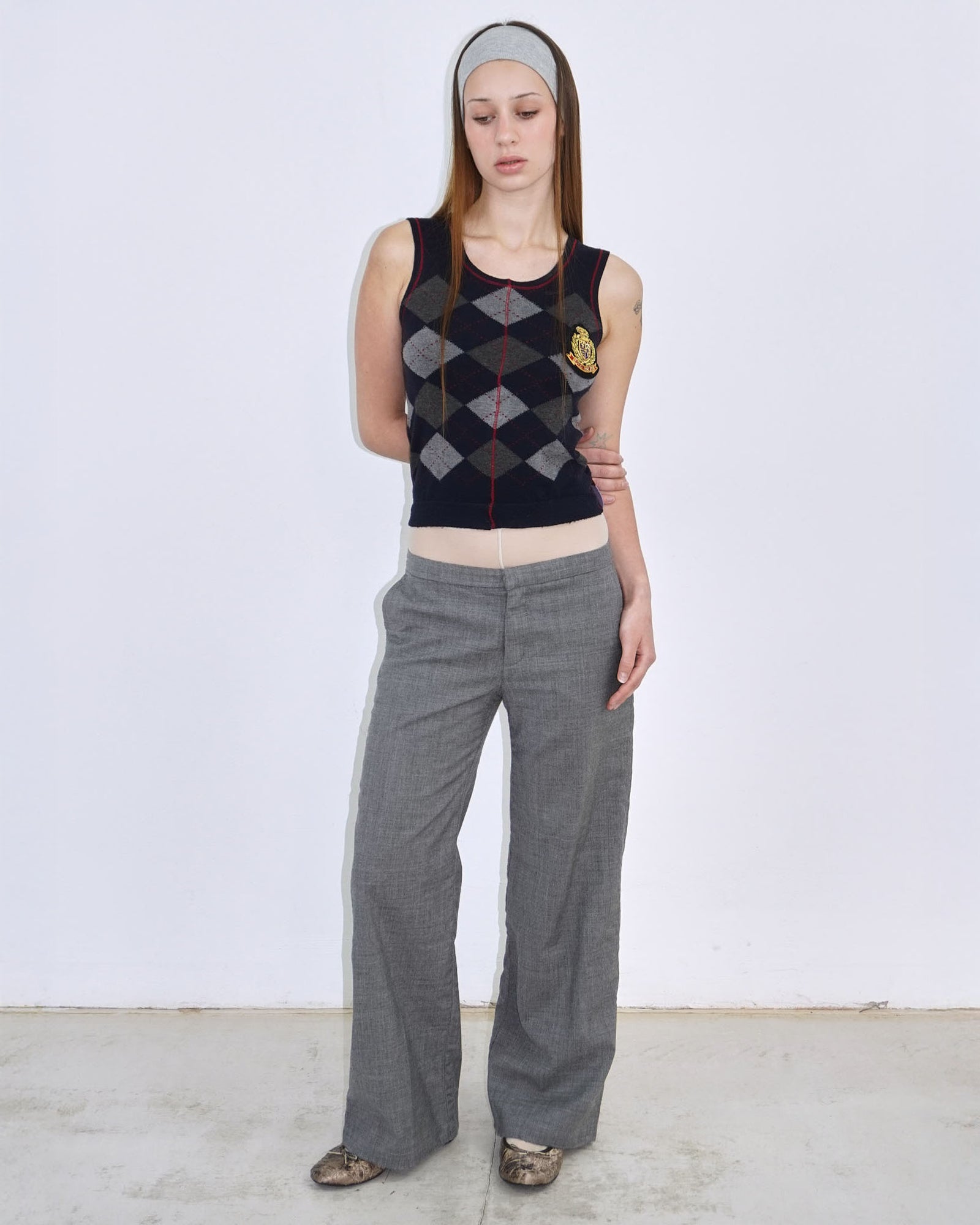 dark blue argyle plunder-style knit top