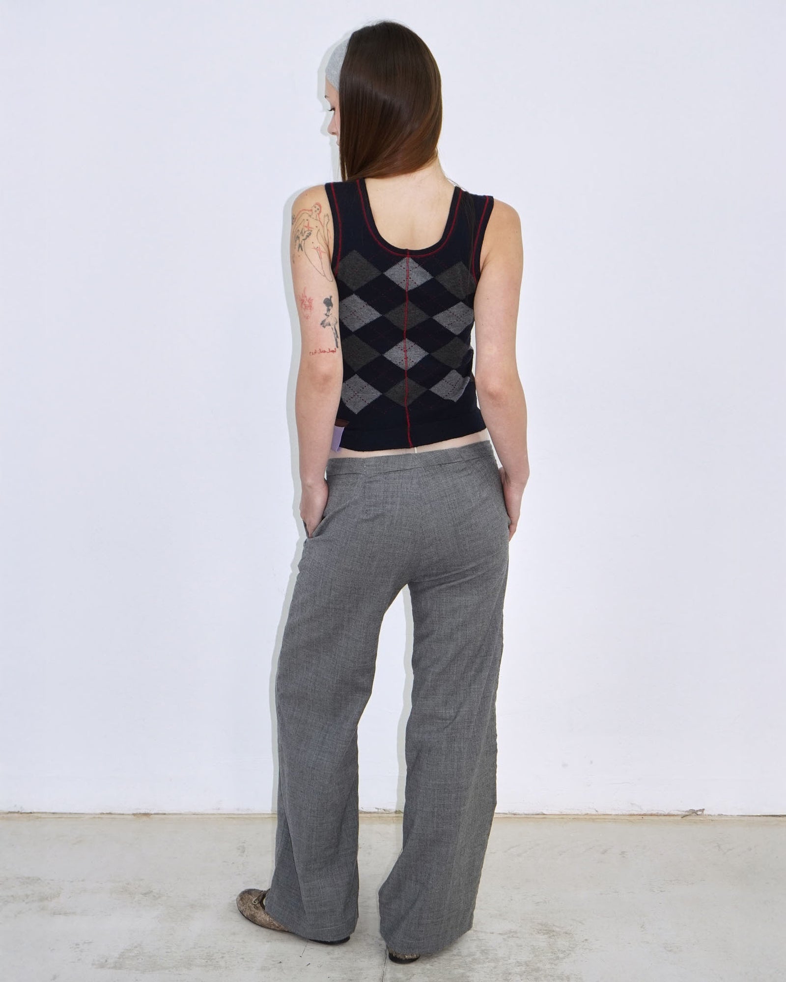 dark blue argyle plunder-style knit top