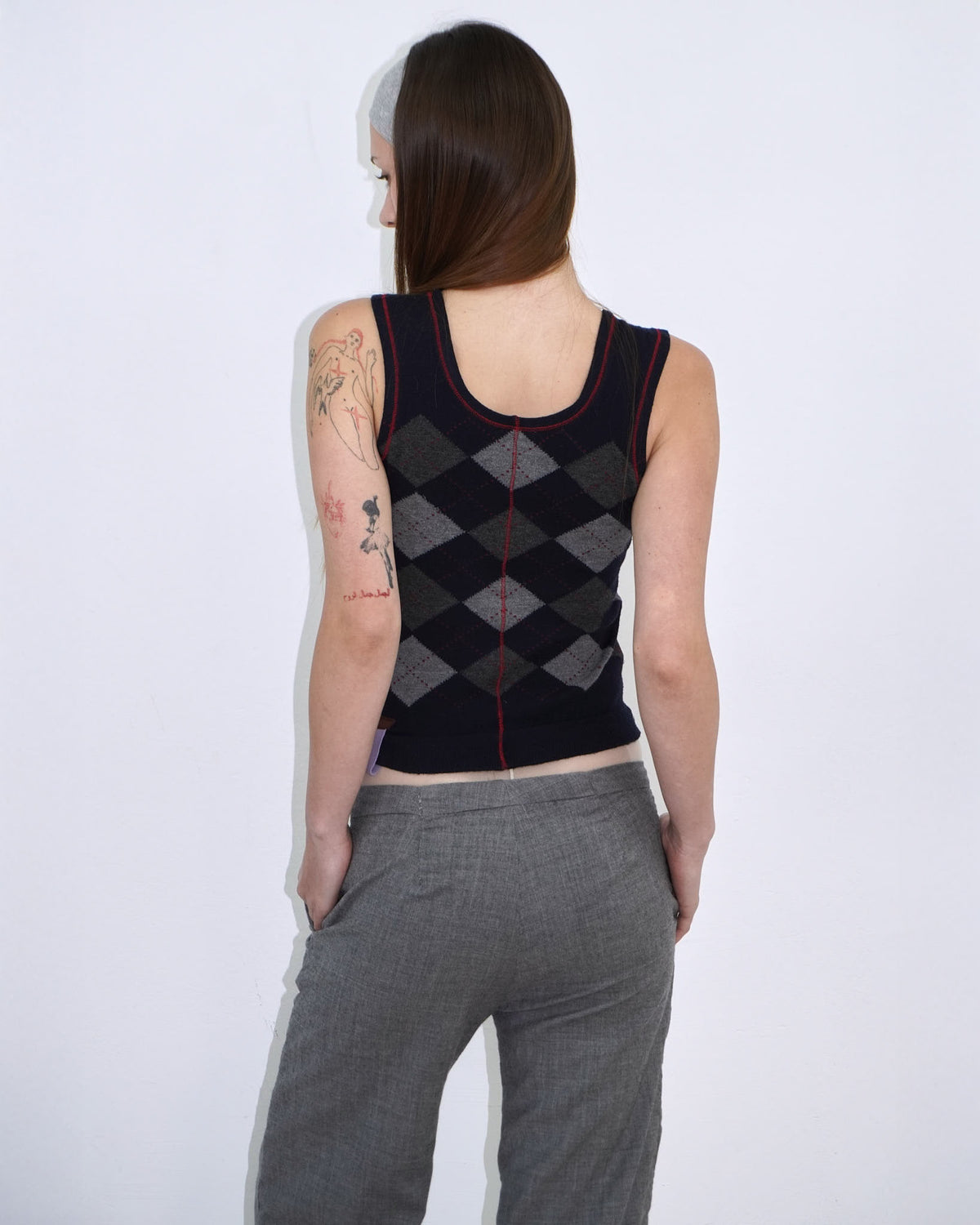 dark blue argyle plunder-style knit top