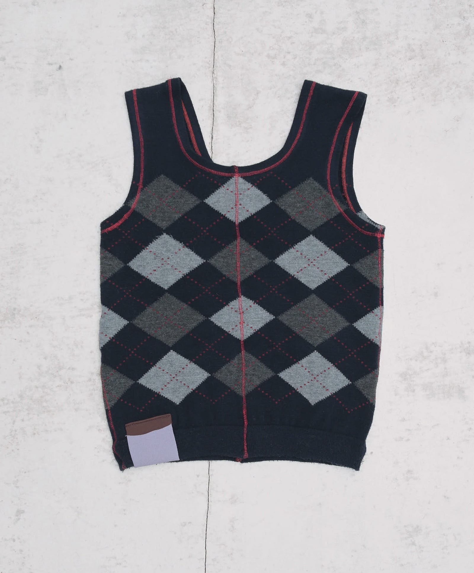 dark blue argyle plunder-style knit top