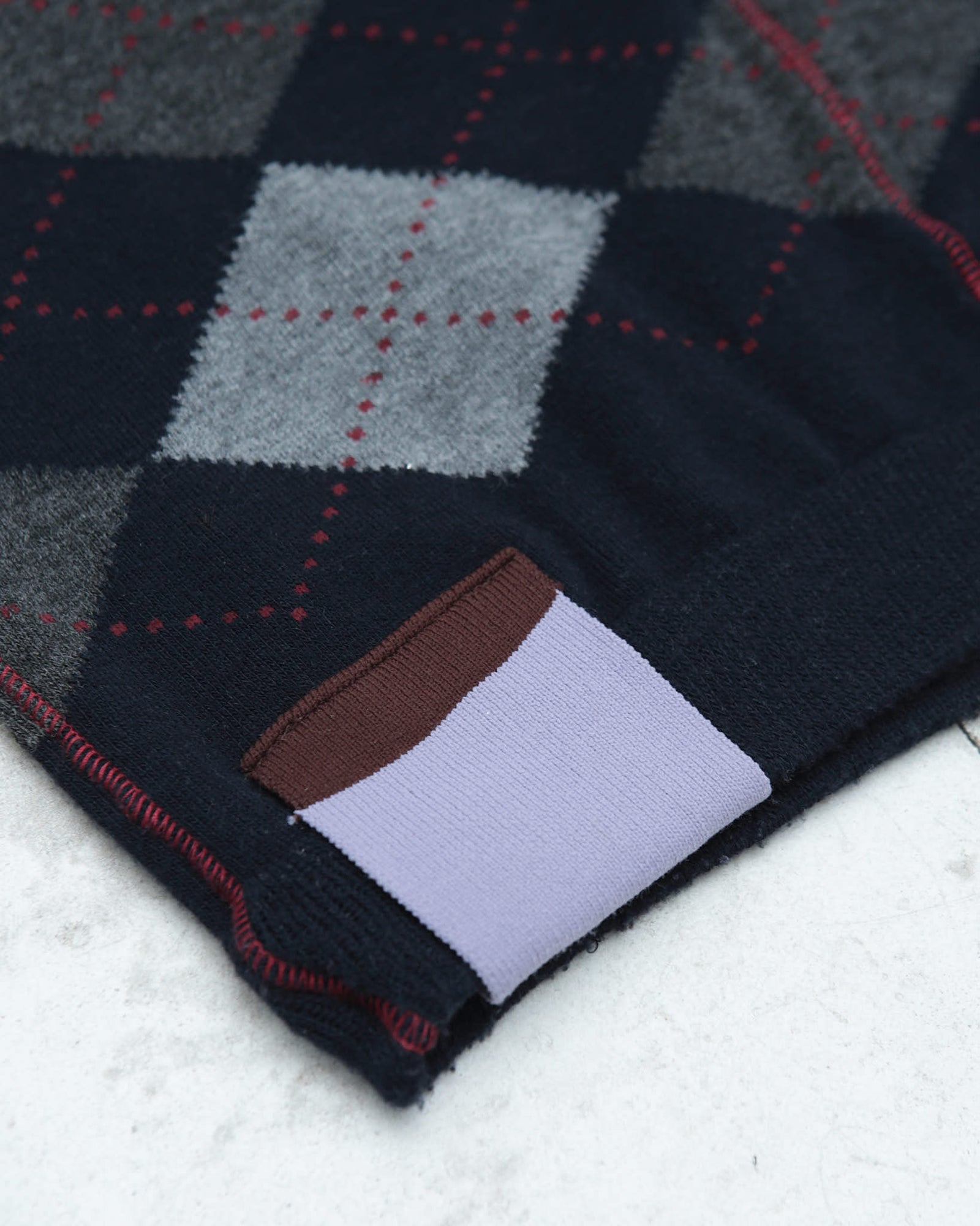 dark blue argyle plunder-style knit top