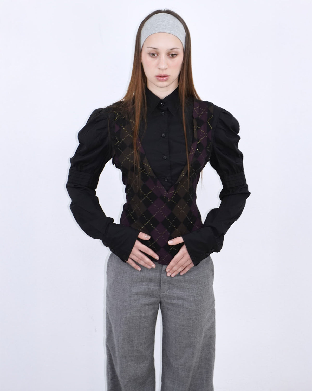 black shirt with gold and purple argyle patterned vest