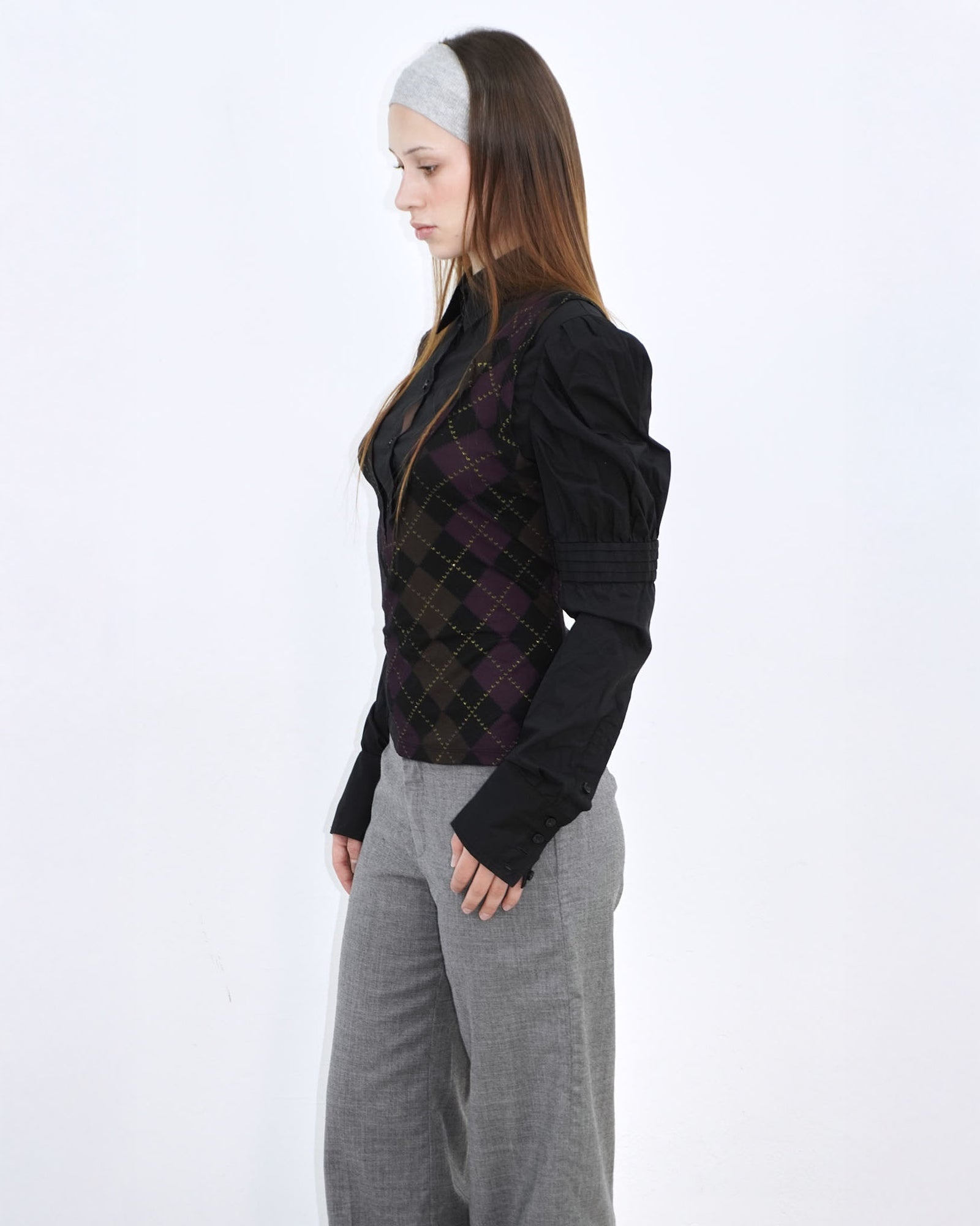 black shirt with gold and purple argyle patterned vest