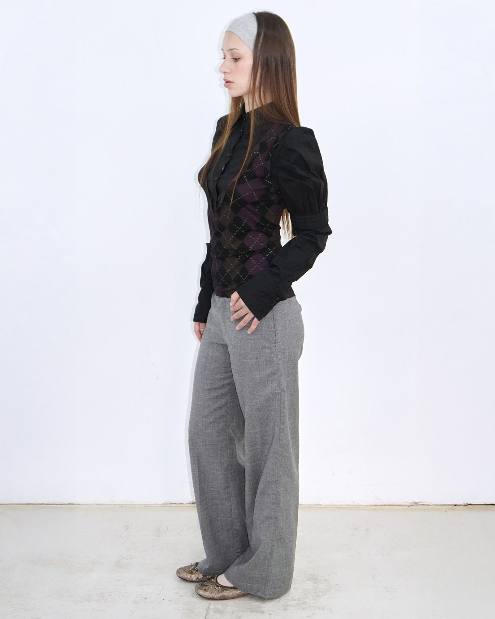 black shirt with gold and purple argyle patterned vest