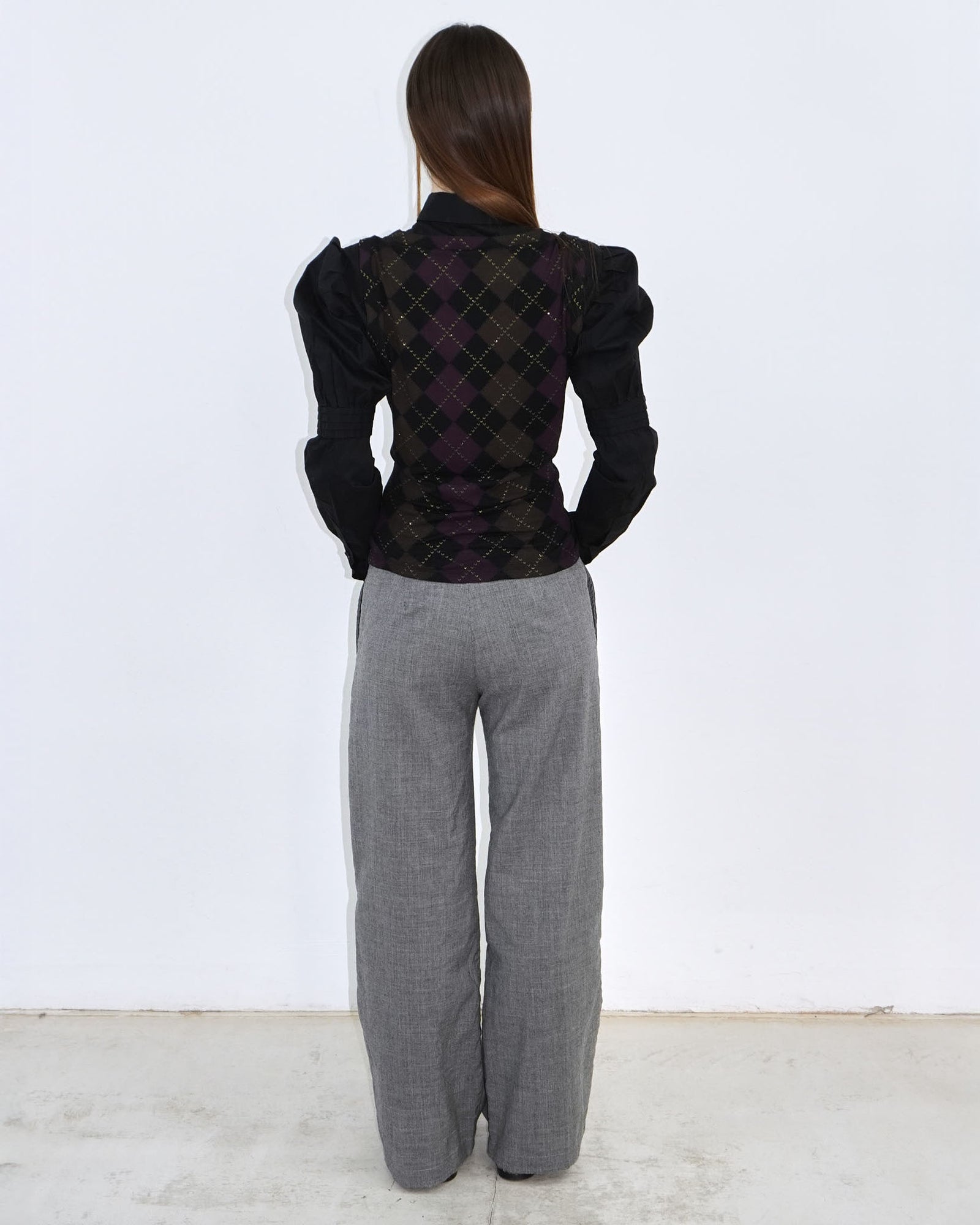 black shirt with gold and purple argyle patterned vest