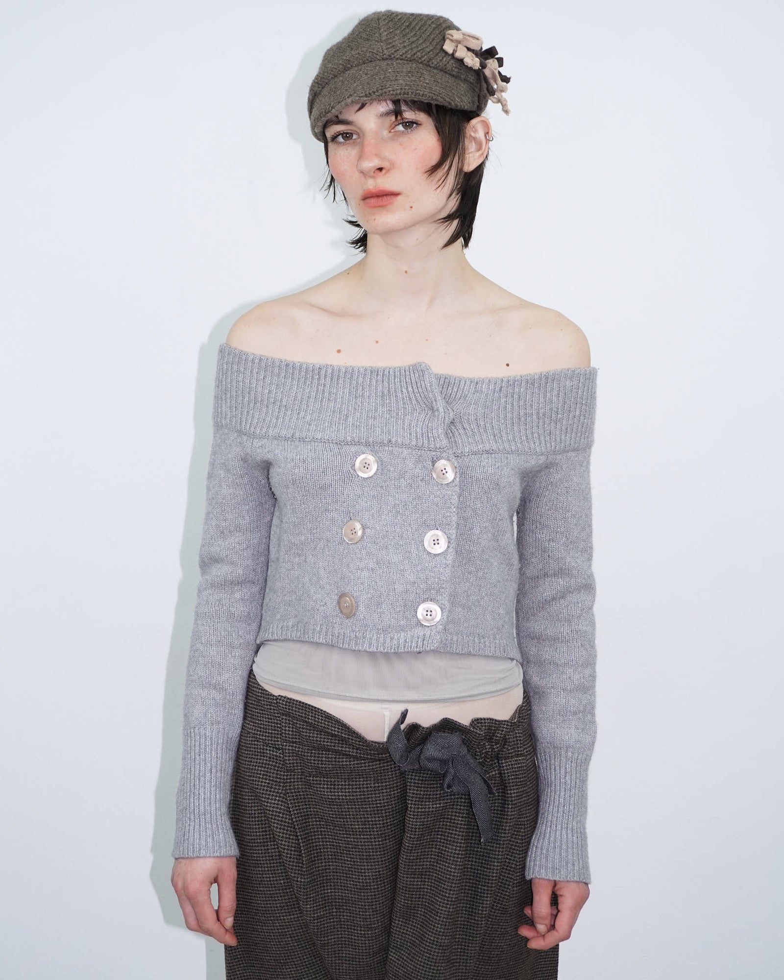brown knit cap with floral detail
