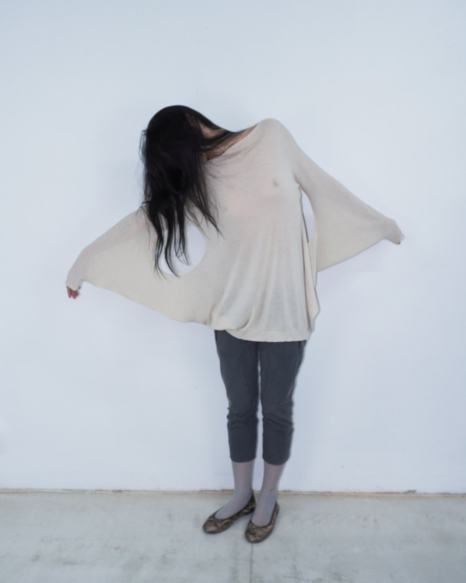 cream knit top with cut out details