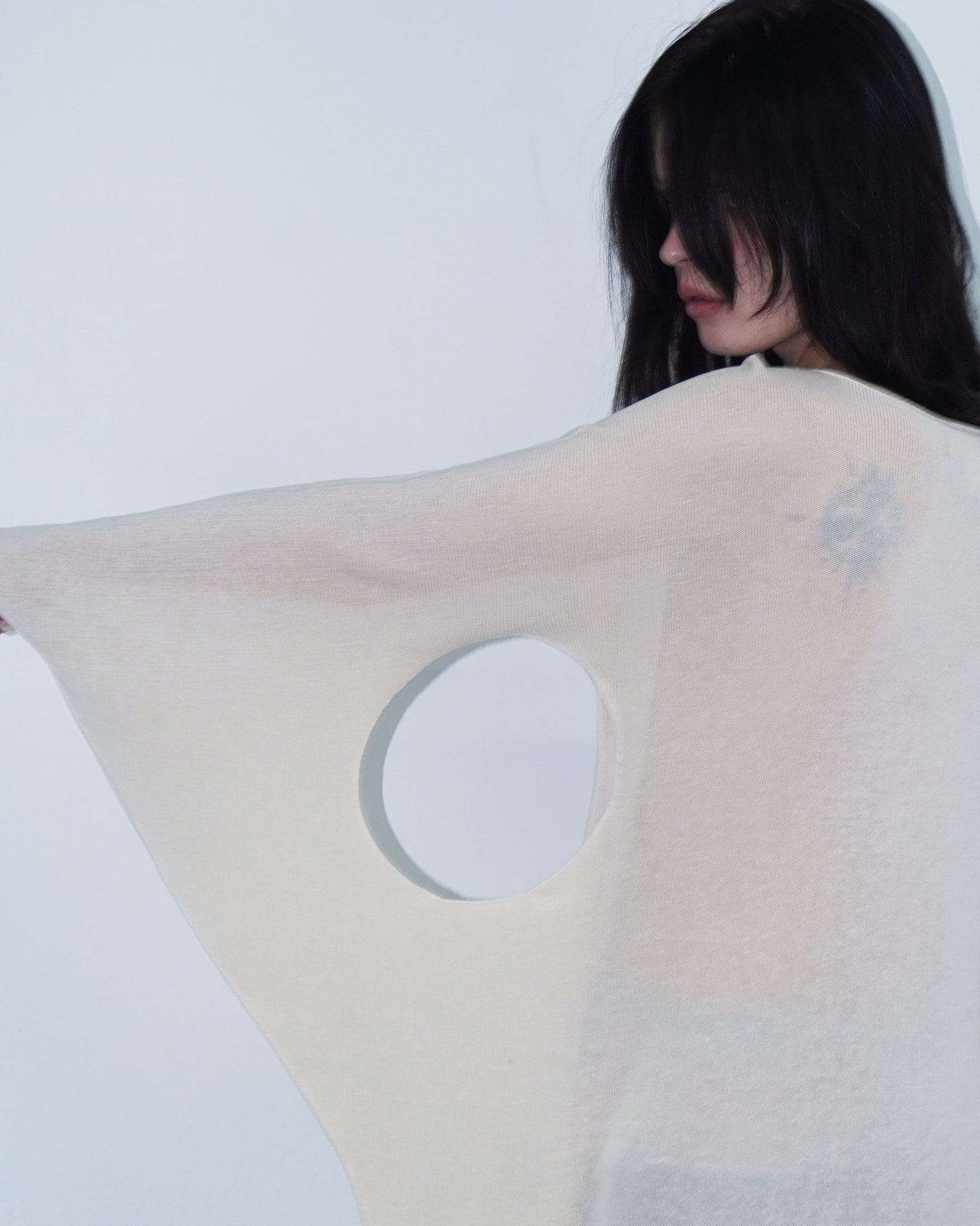 cream knit top with cut out details