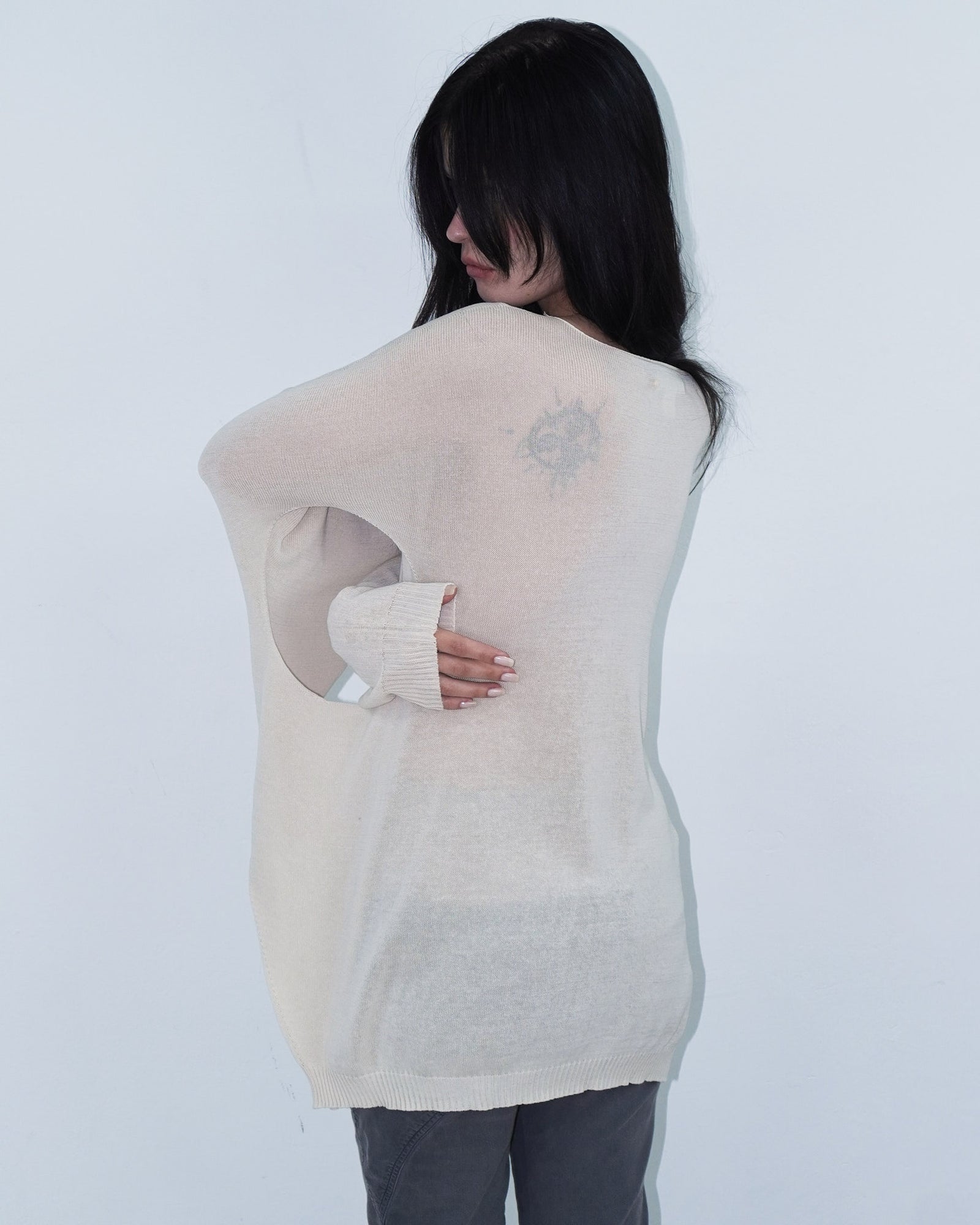 cream knit top with cut out details