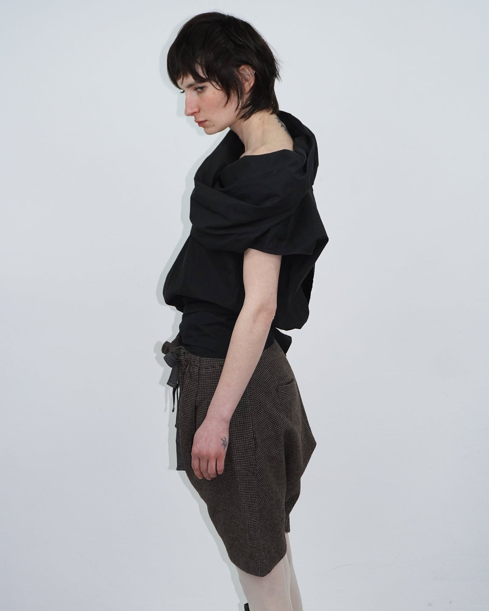 elegant black top with statement neckline
