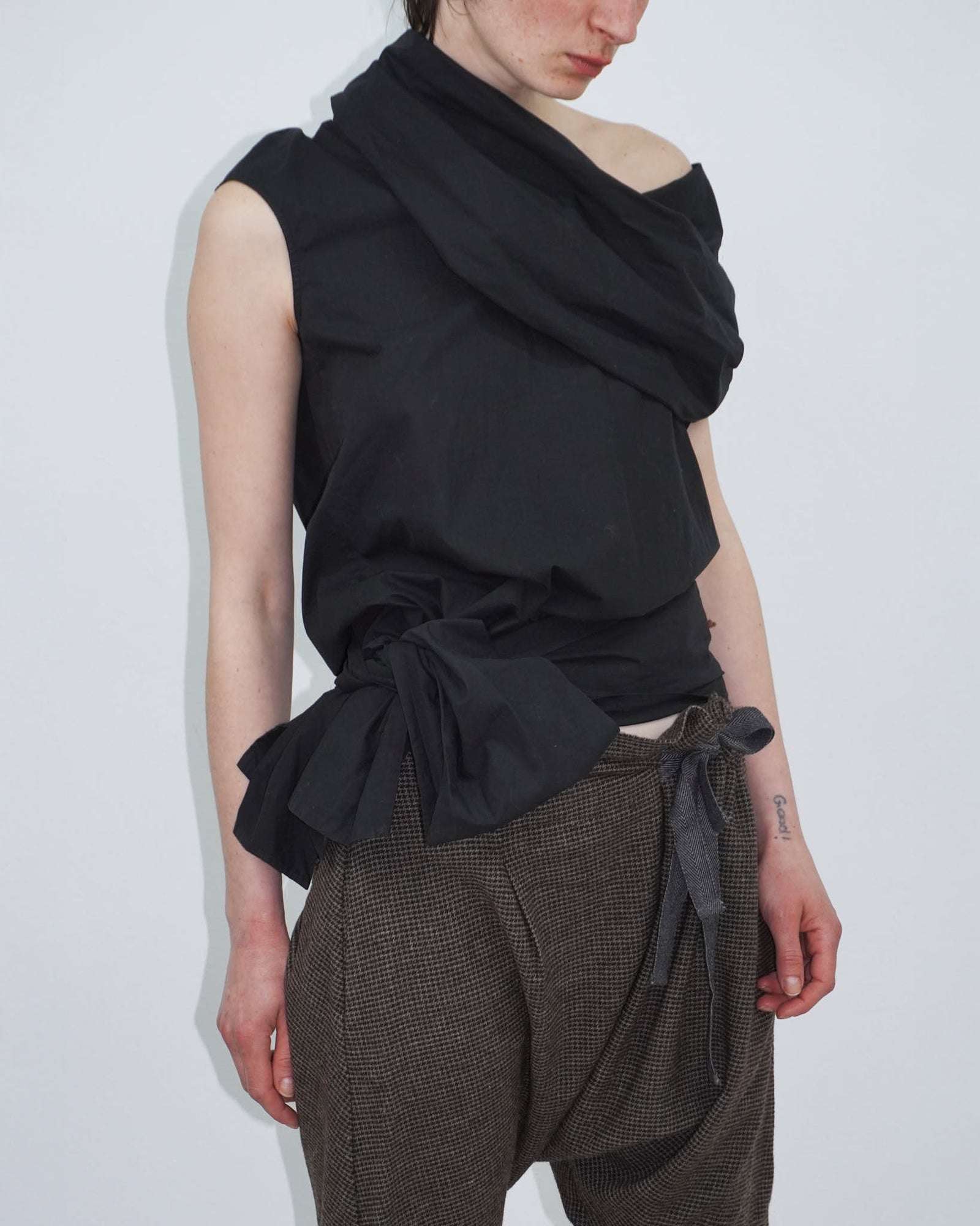 elegant black top with statement neckline