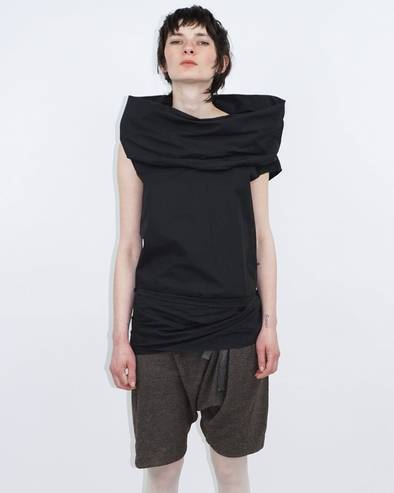 elegant black top with statement neckline