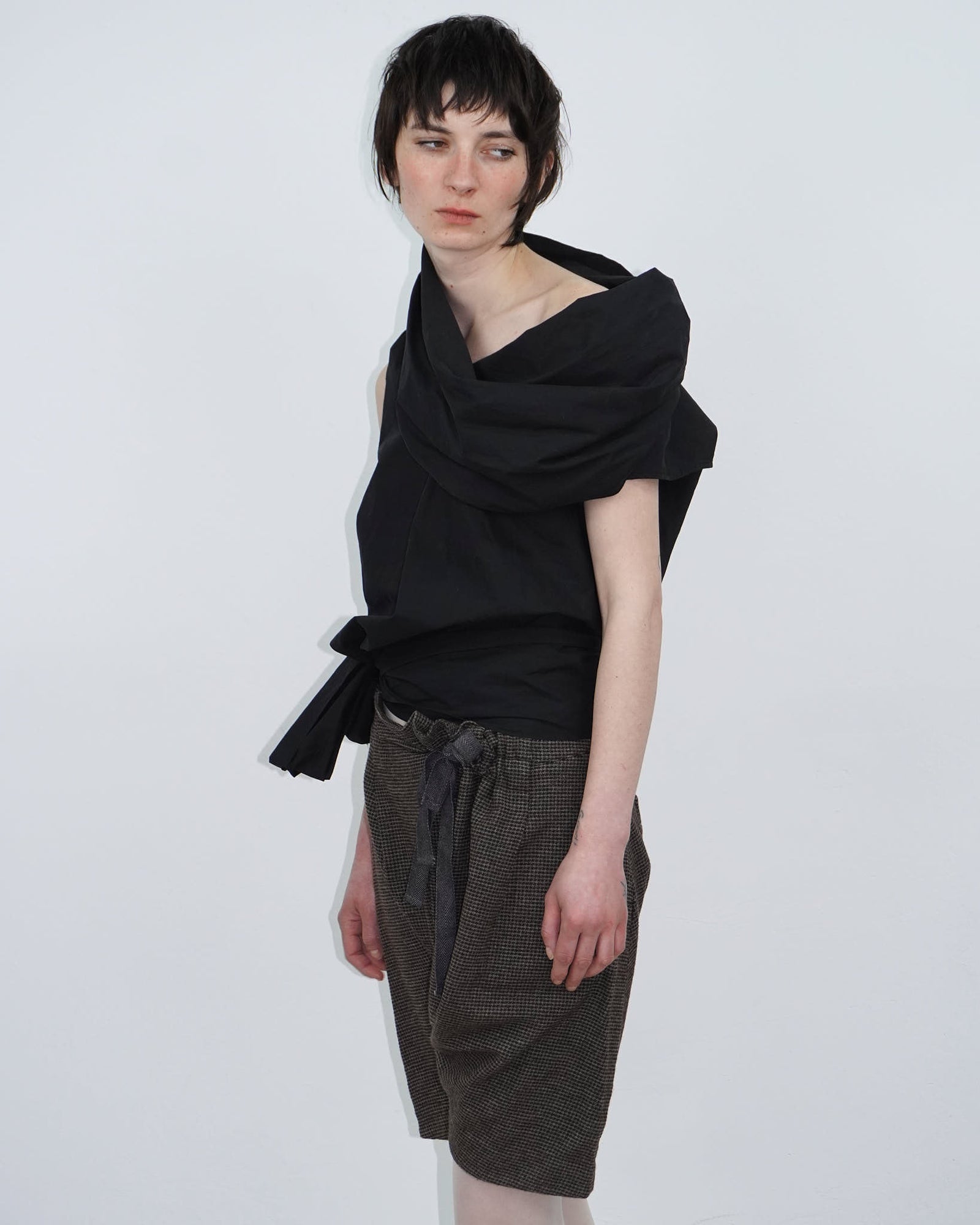 elegant black top with statement neckline