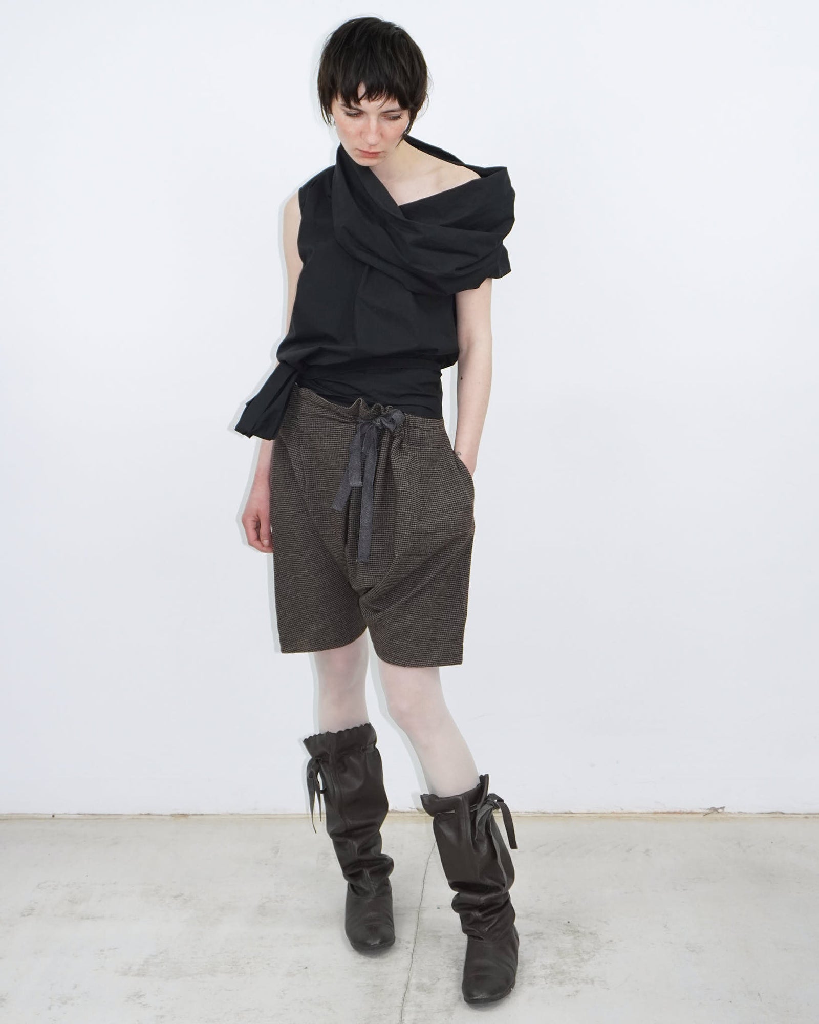elegant black top with statement neckline