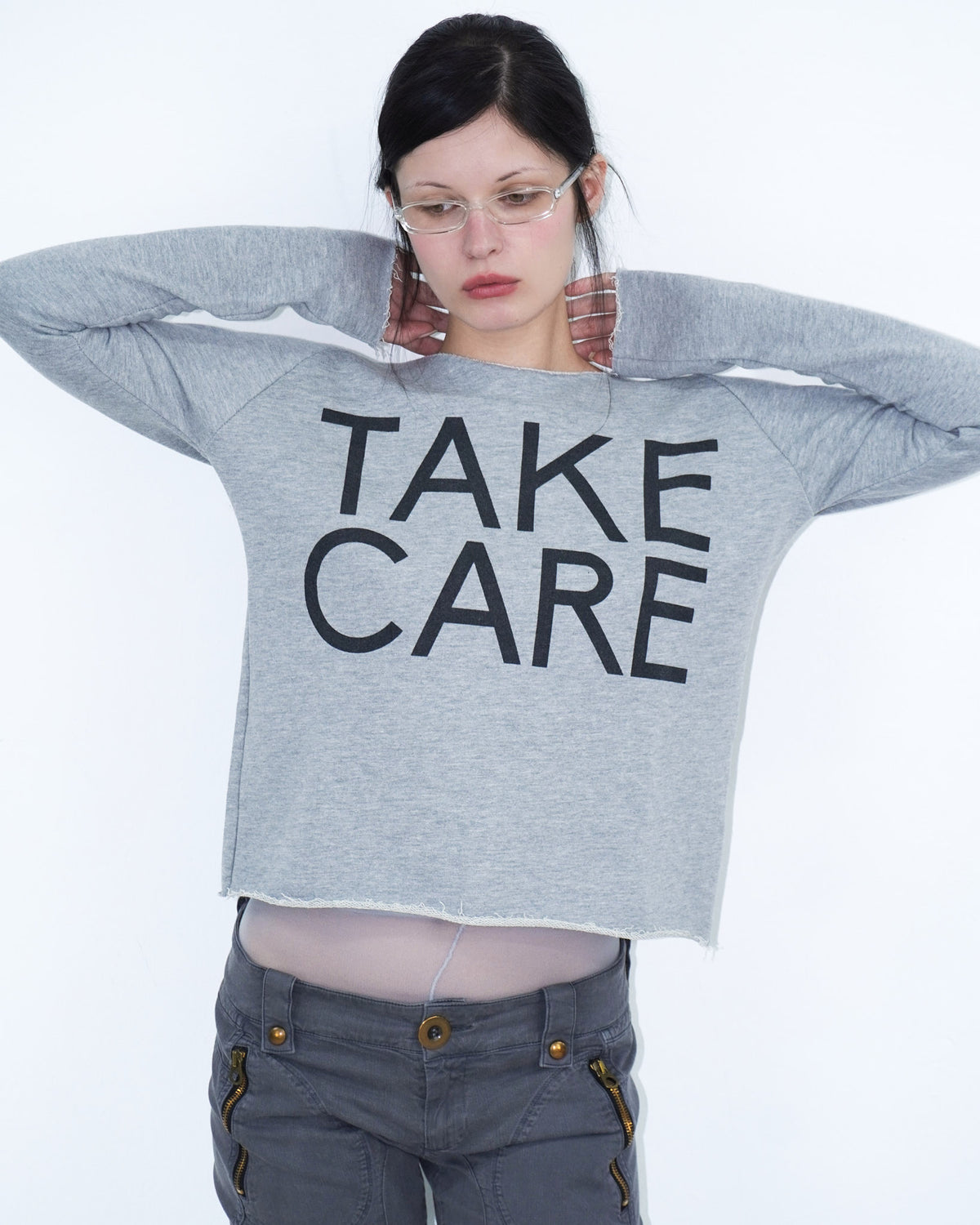 grey off shoulder top with graphical writing