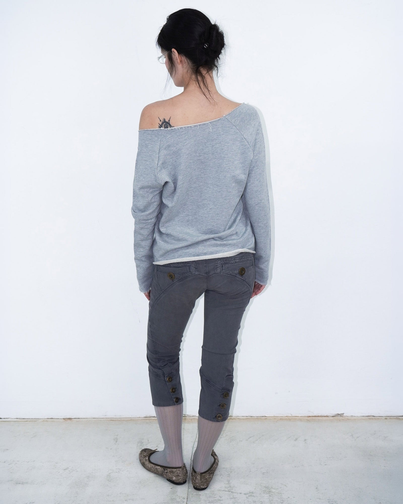 grey off shoulder top with graphical writing