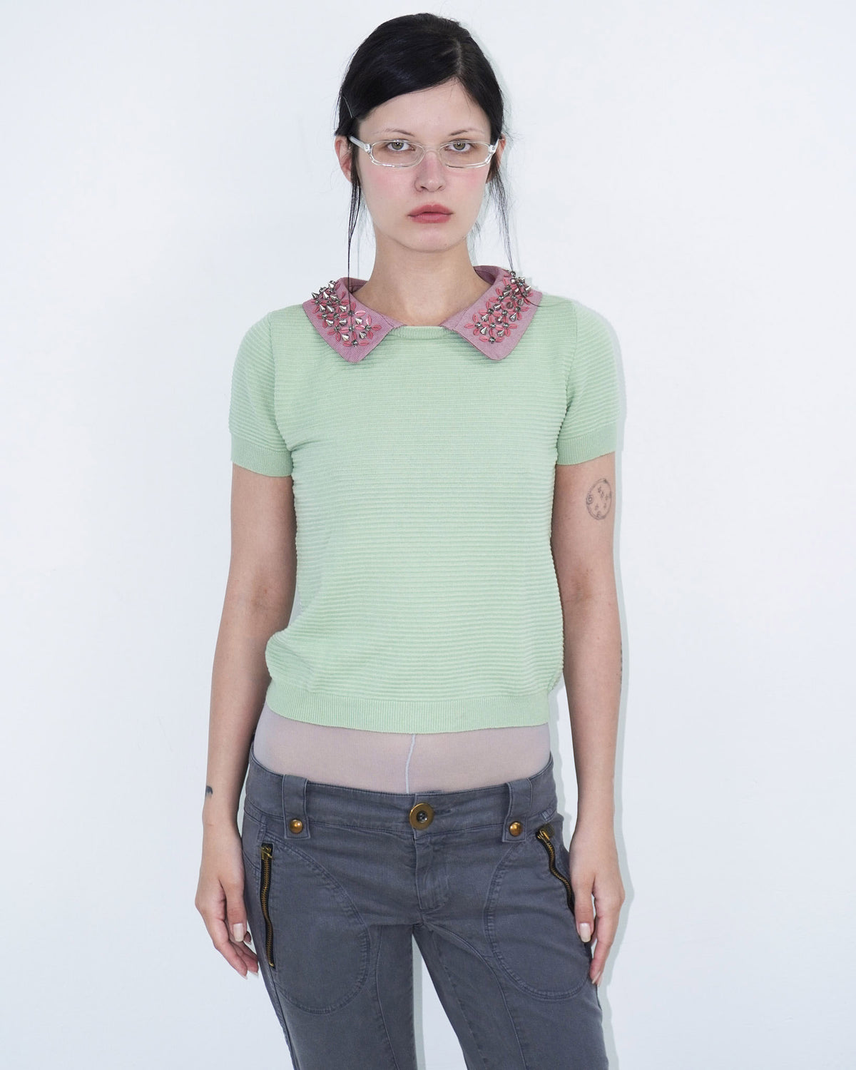 light green structured top with pink, studded collar
