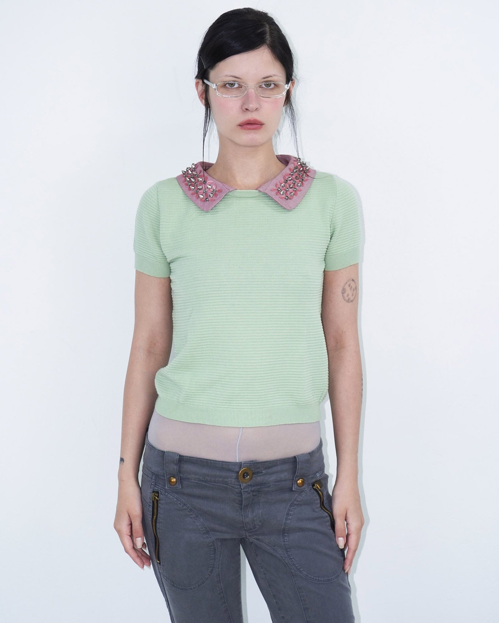 light green structured top with pink, studded collar