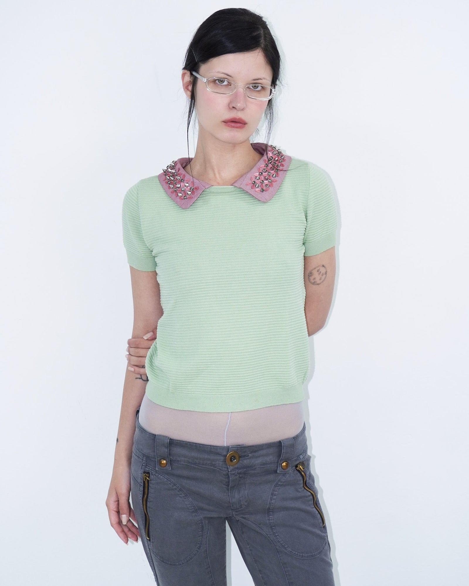 light green structured top with pink, studded collar