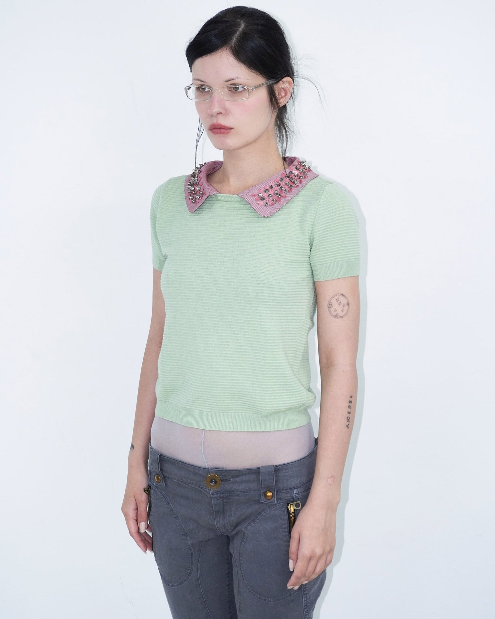 light green structured top with pink, studded collar