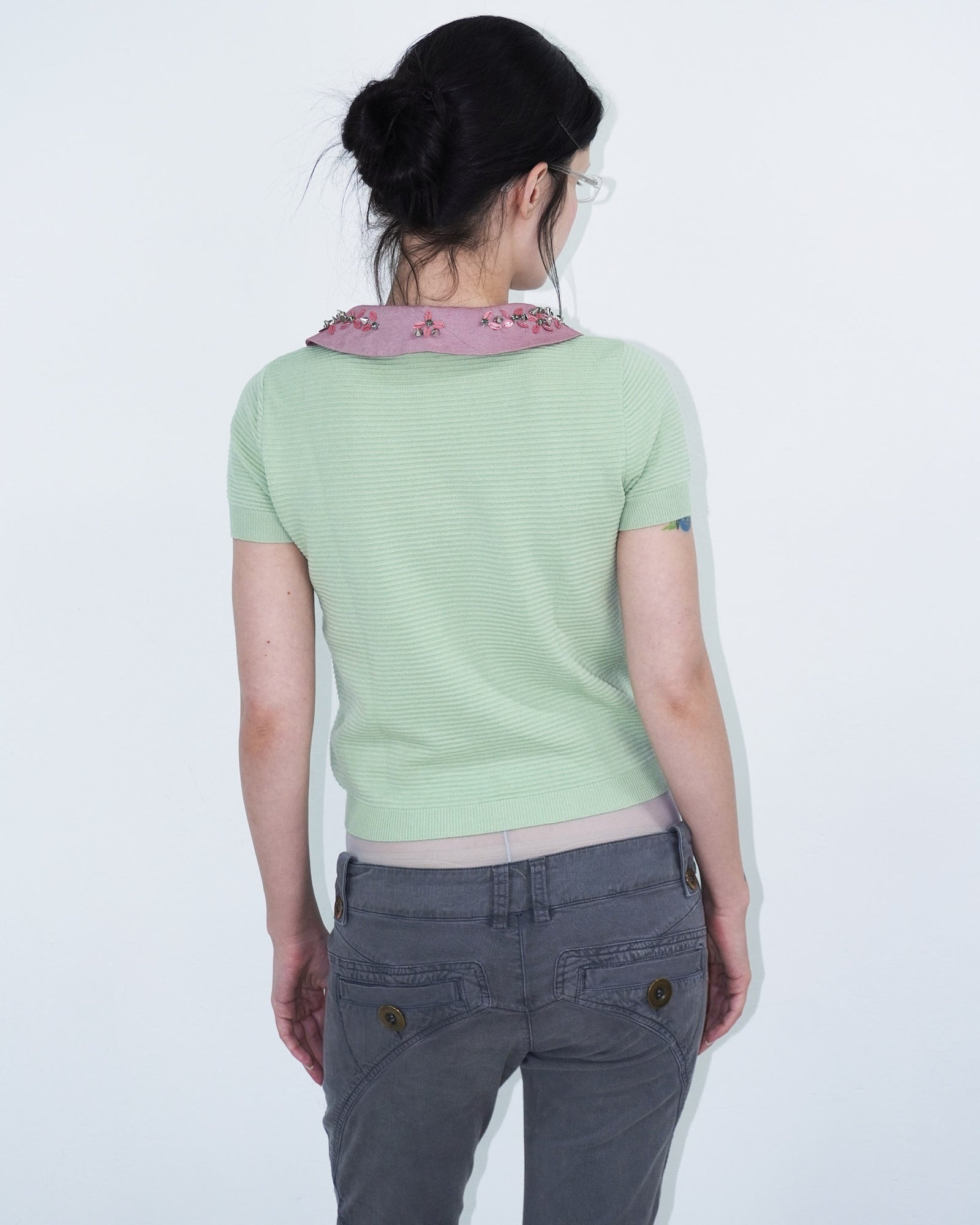 light green structured top with pink, studded collar