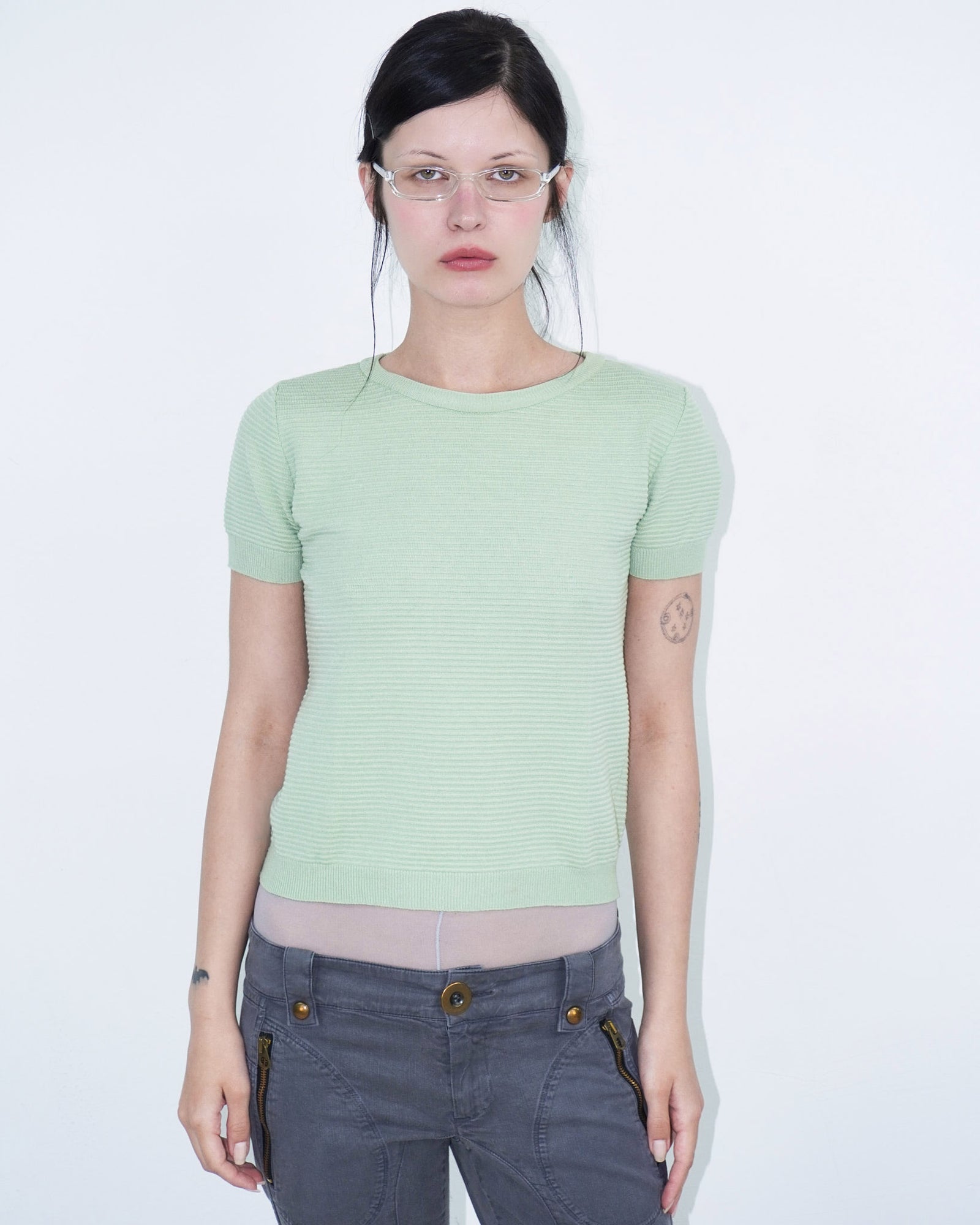 light green structured top with pink, studded collar