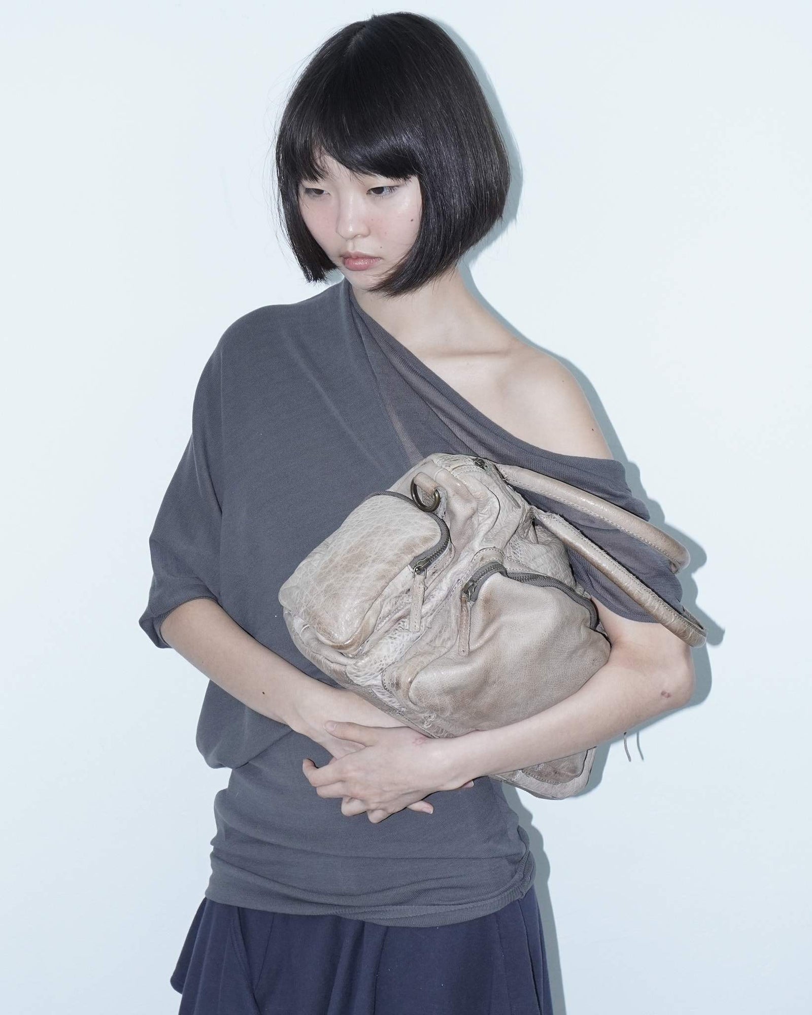 medium beige multi pocket textured leather bag