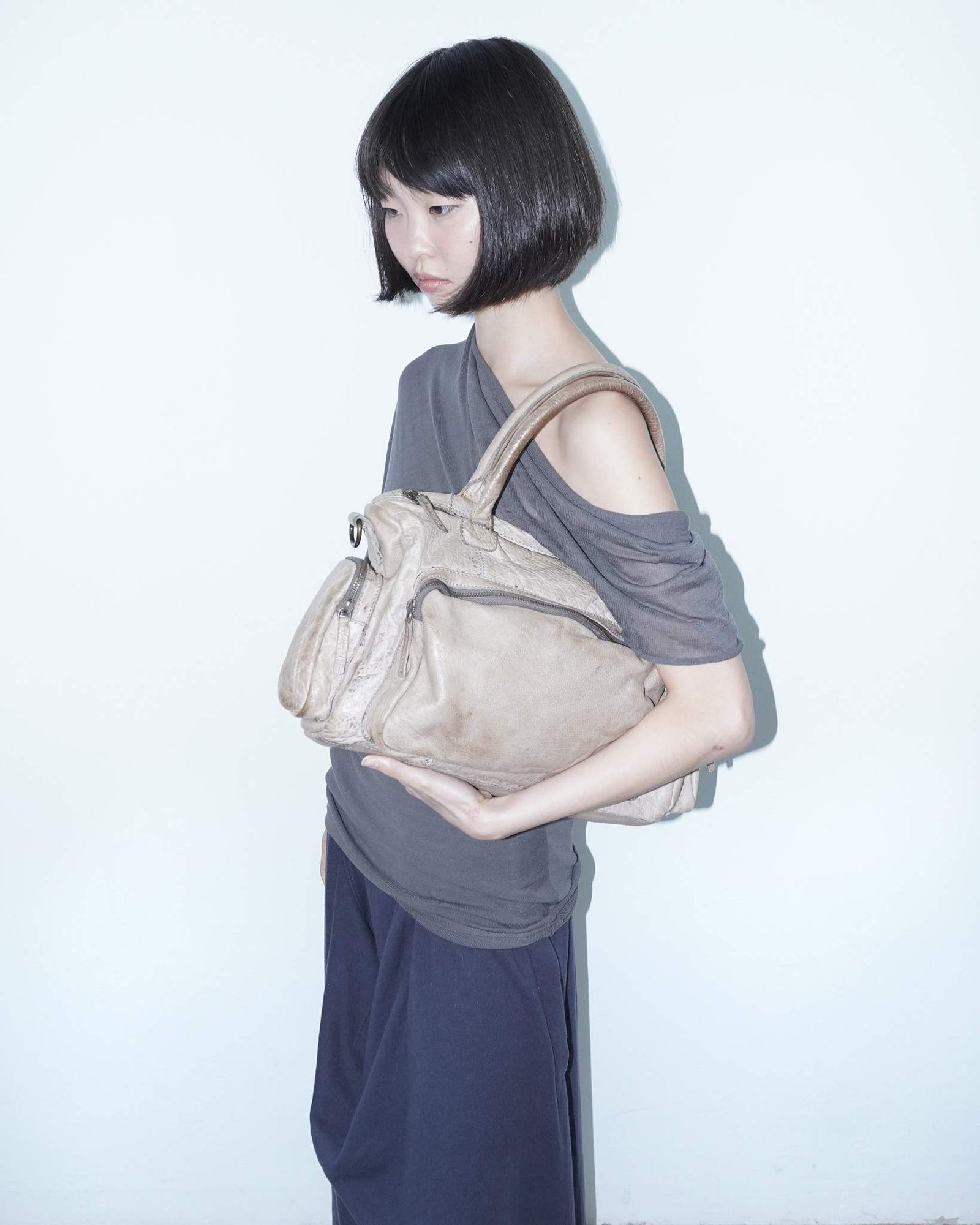 medium beige multi pocket textured leather bag